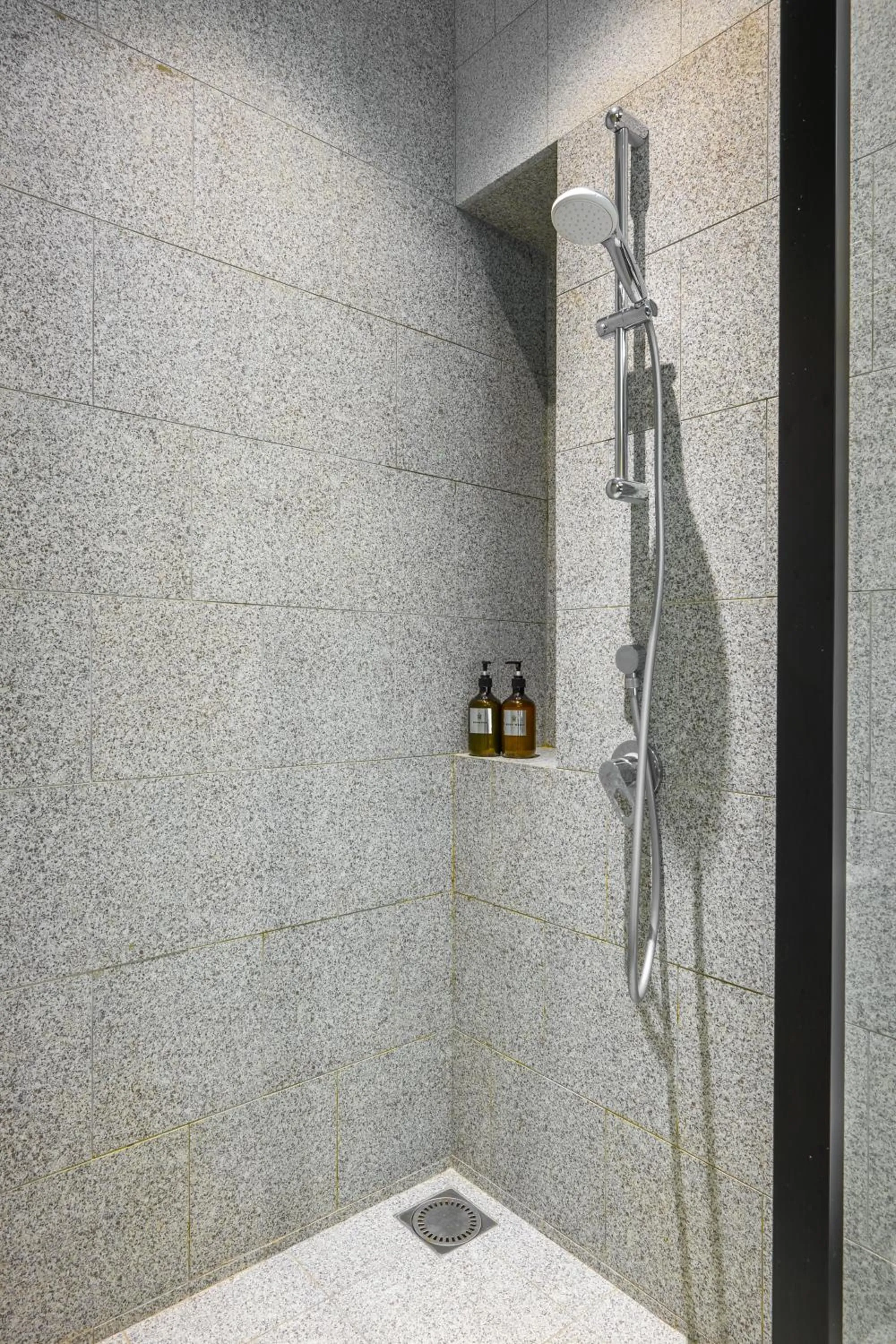 Shower in Greystone Scarletz Suites