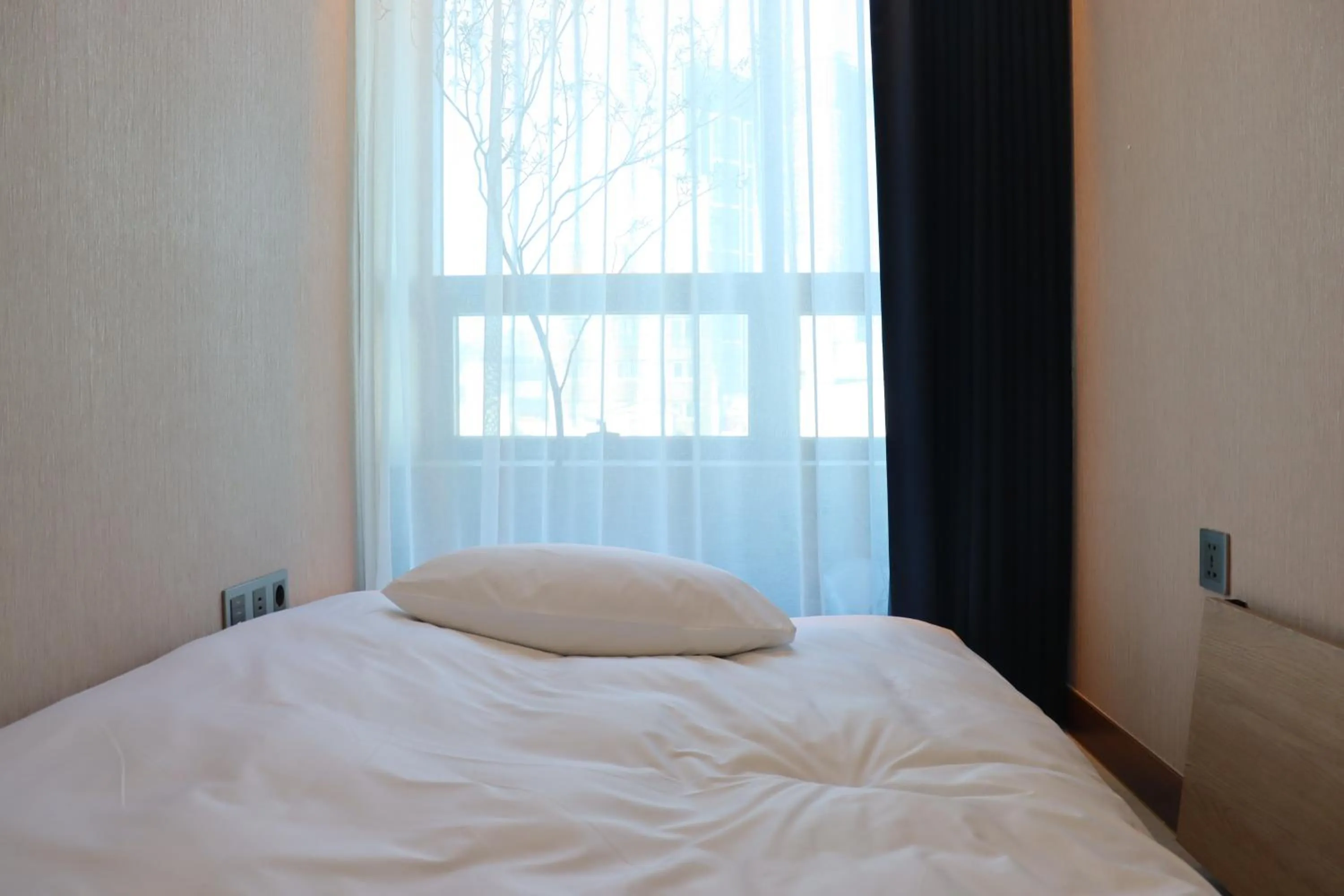 Bed in Hotel tt Gupo