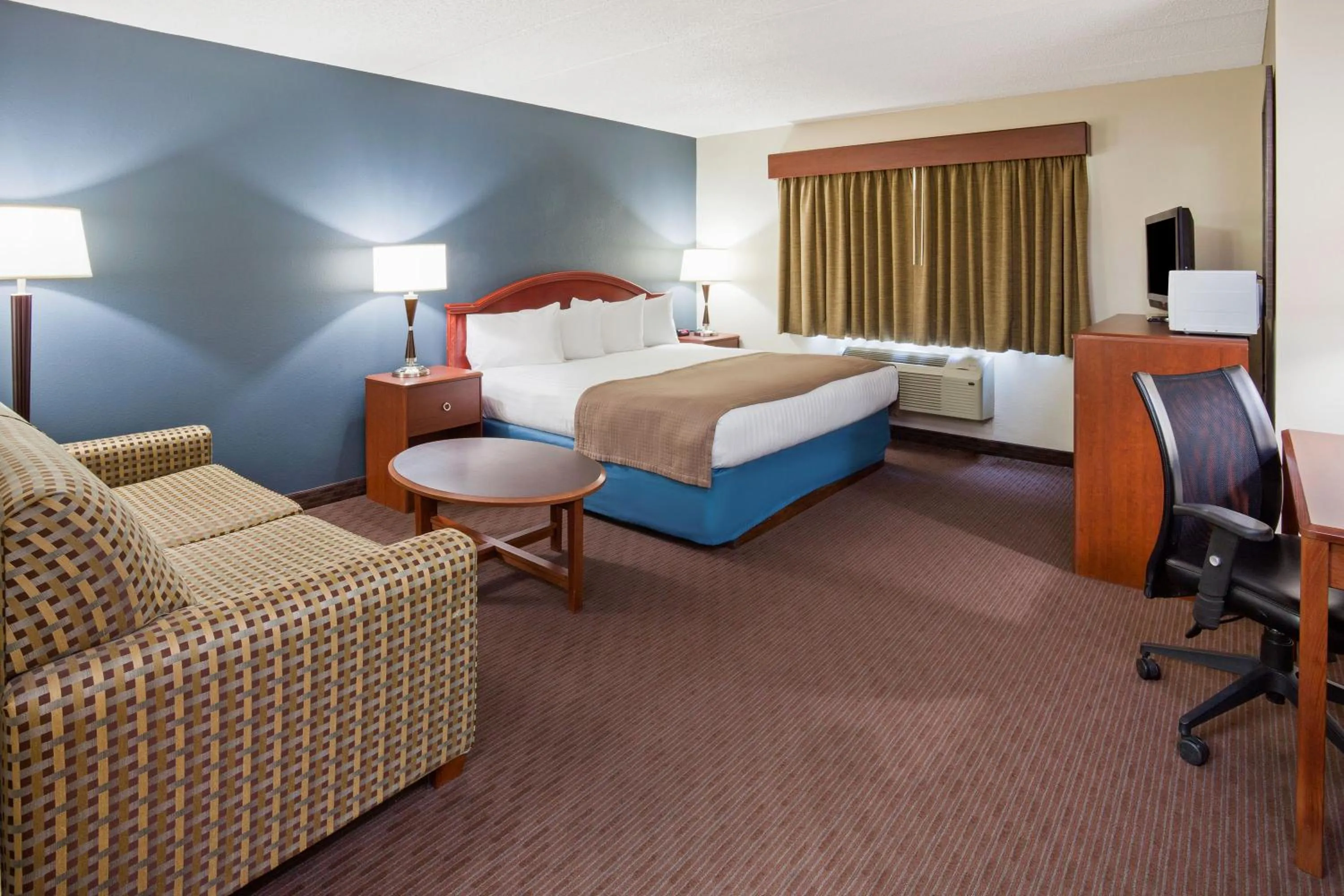 Photo of the whole room, Bed in AmericInn by Wyndham Spencer