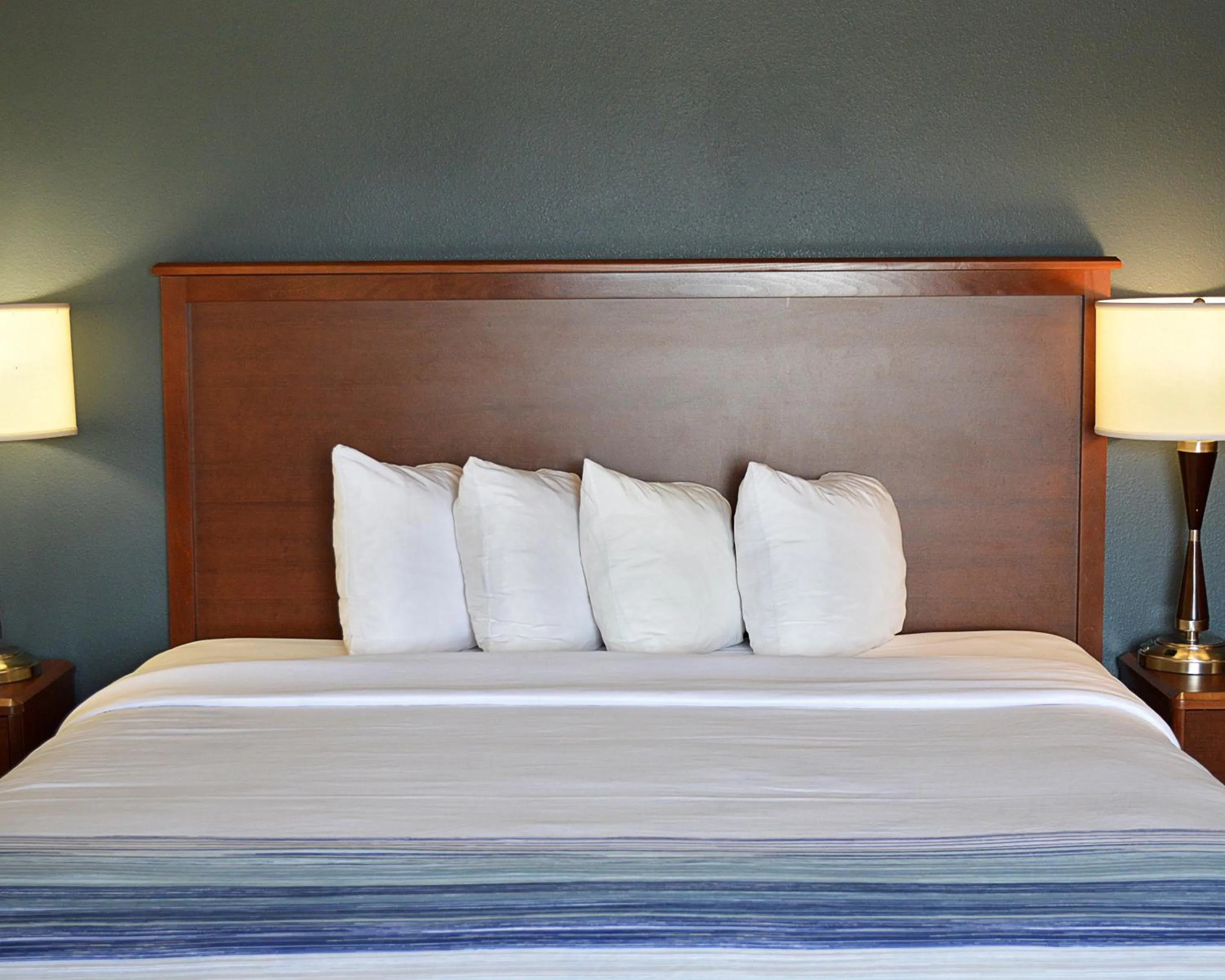 Bed in AmericInn by Wyndham Spencer
