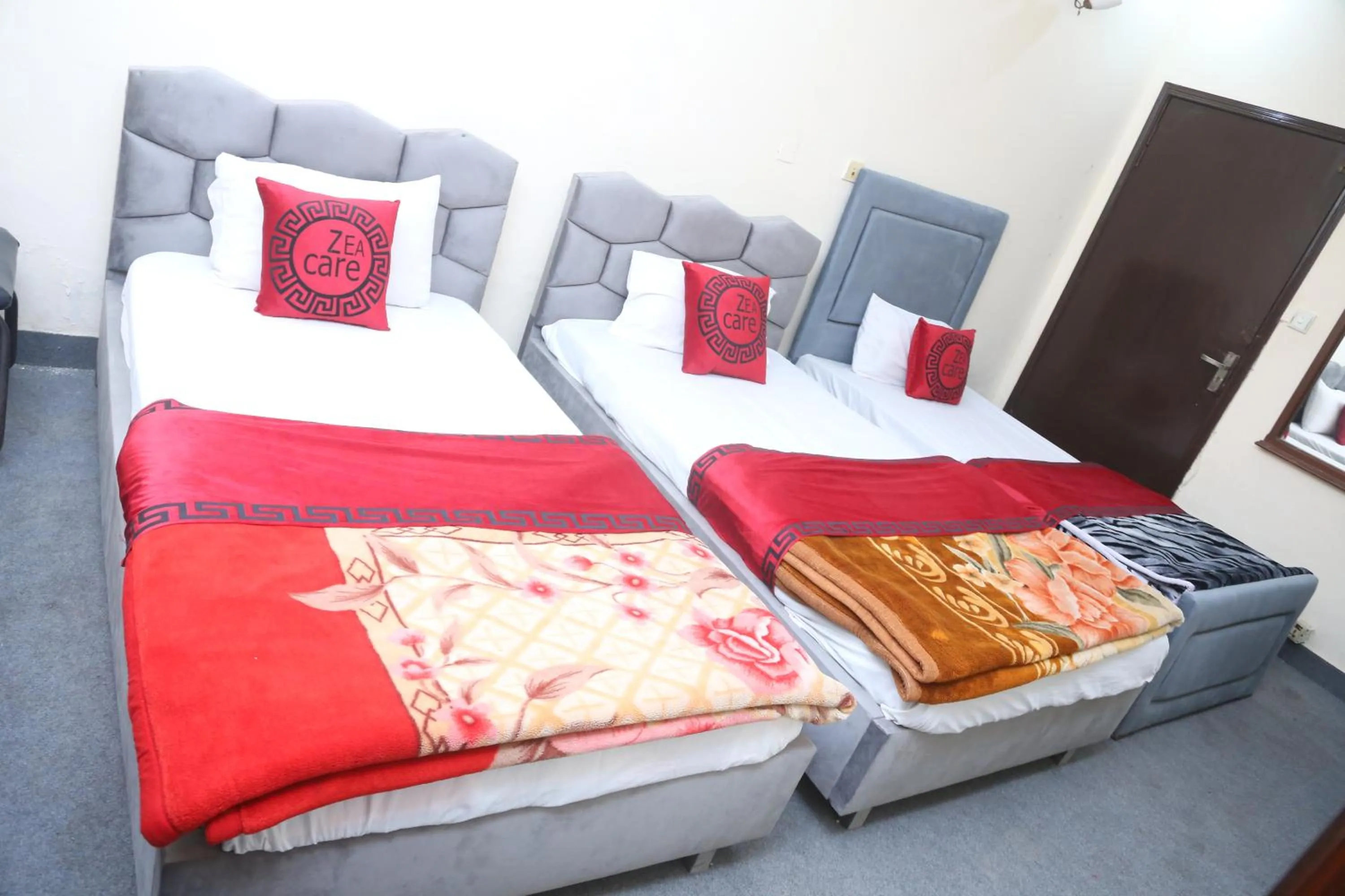 Living room, Bed in Hotel Zea Care Johar Town Lahore