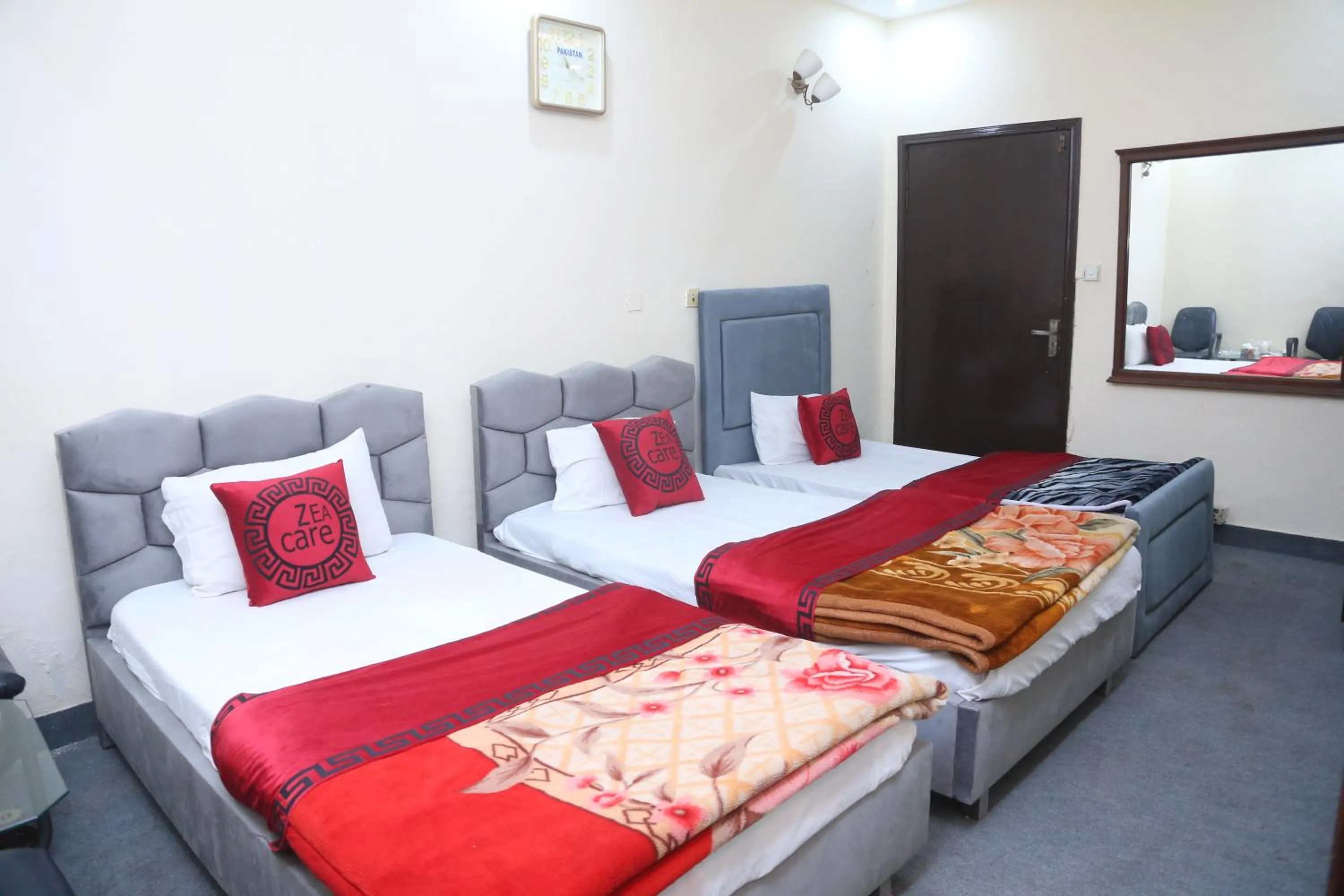Living room, Bed in Hotel Zea Care Johar Town Lahore