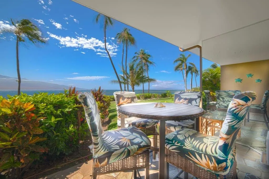 Patio in Stunning Maui Direct Ocean front on the beach, Walk to beach from Condo, Watch Turtles, Whales, AC in all rooms ocean view Pool and Spa