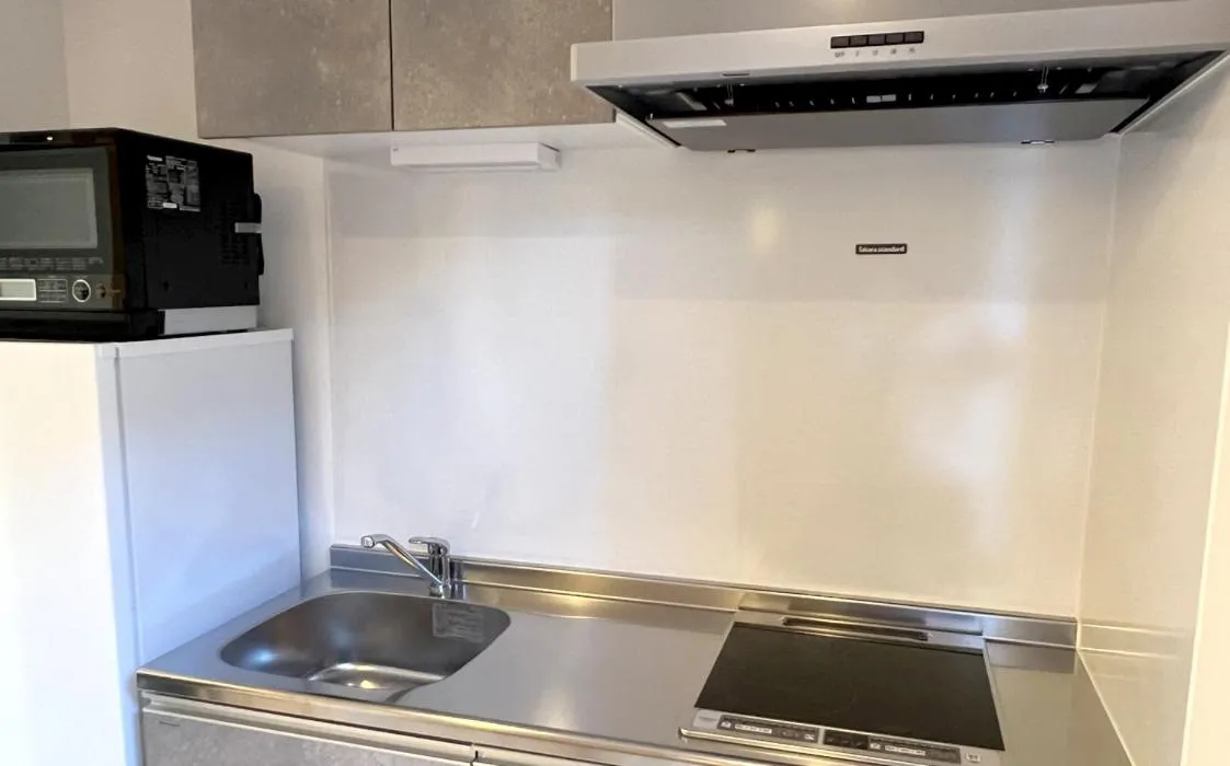 Kitchen or kitchenette in COFFEE HOTEL Soundwave