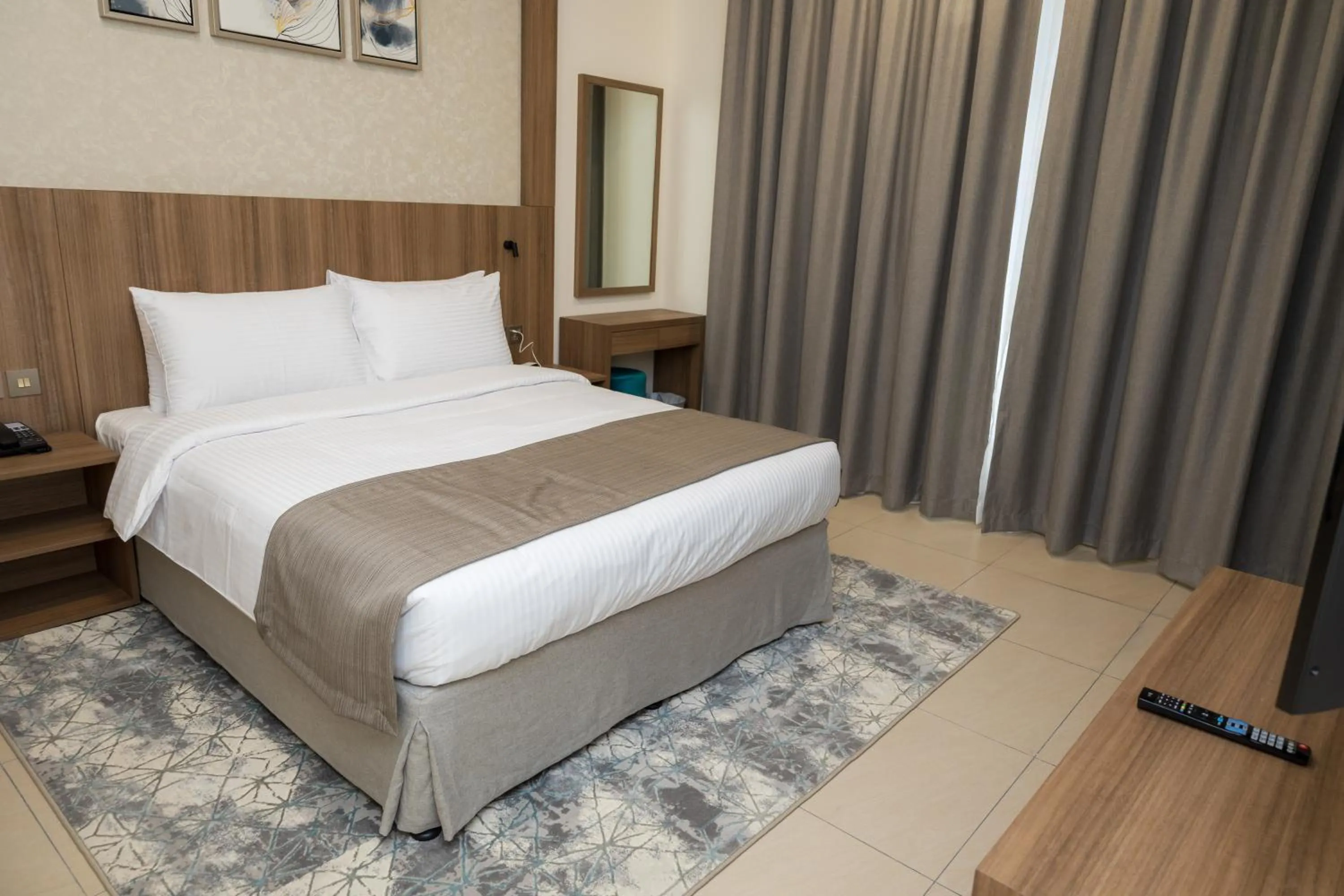 Bed in Azur Regency Hotel Apartments