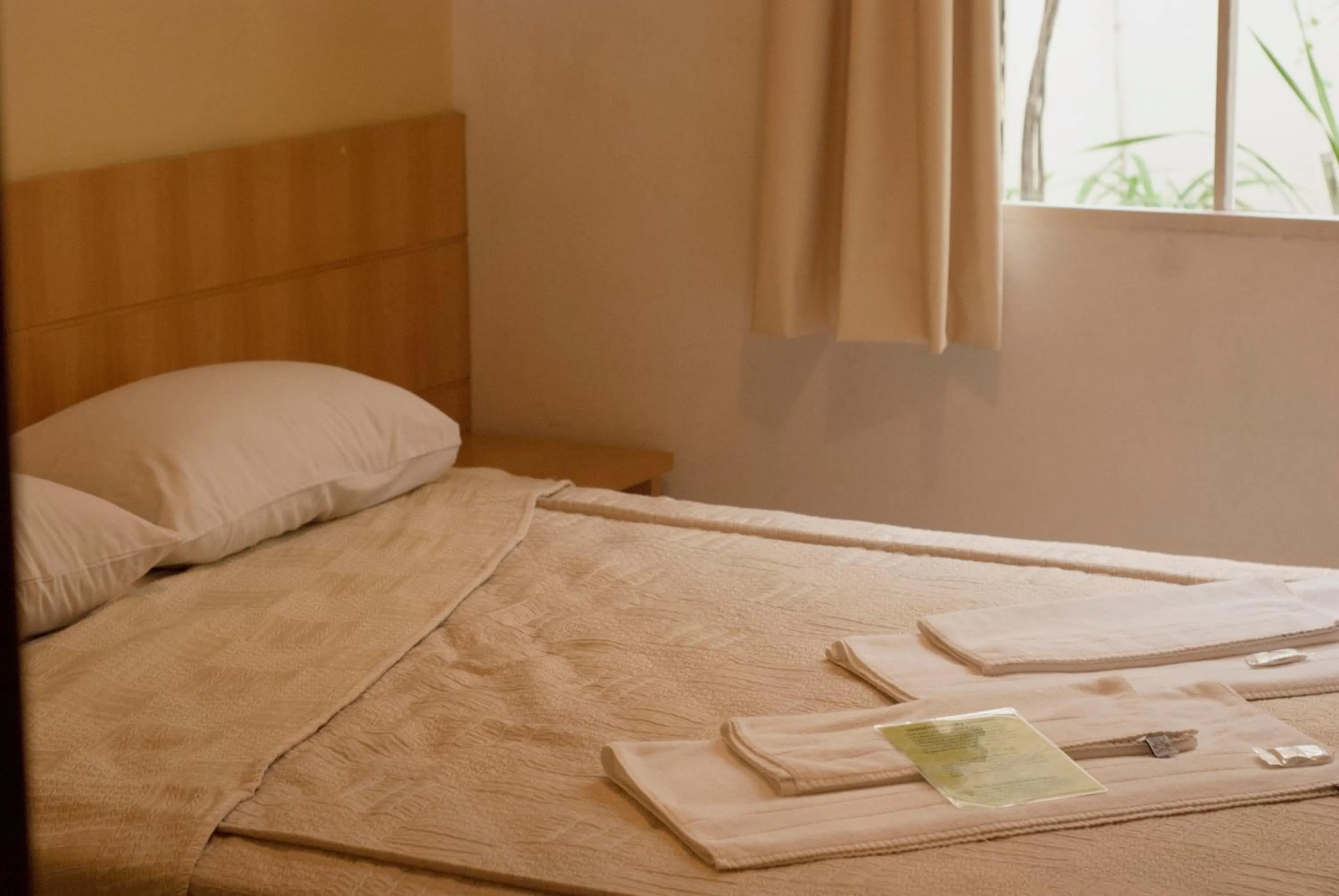 Bed in Hara Palace Hotel