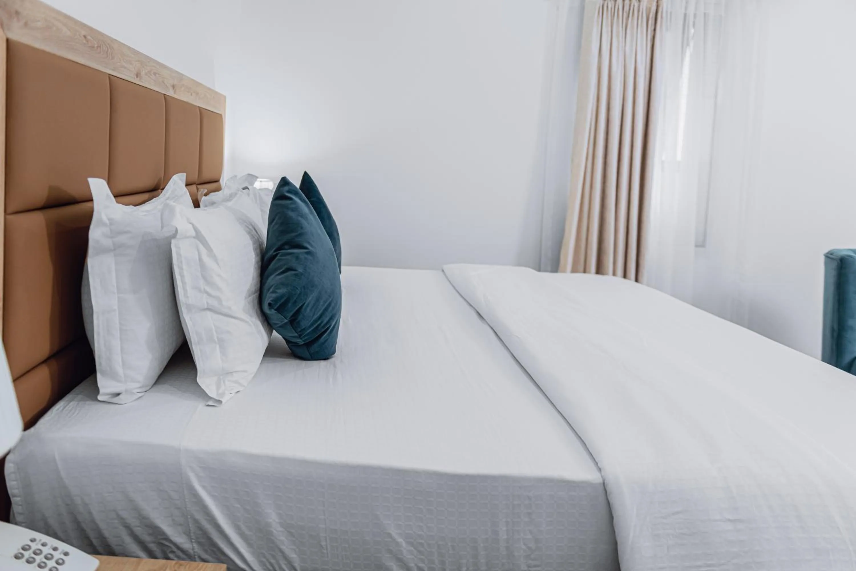 Bed in Quest Boutique Hotel