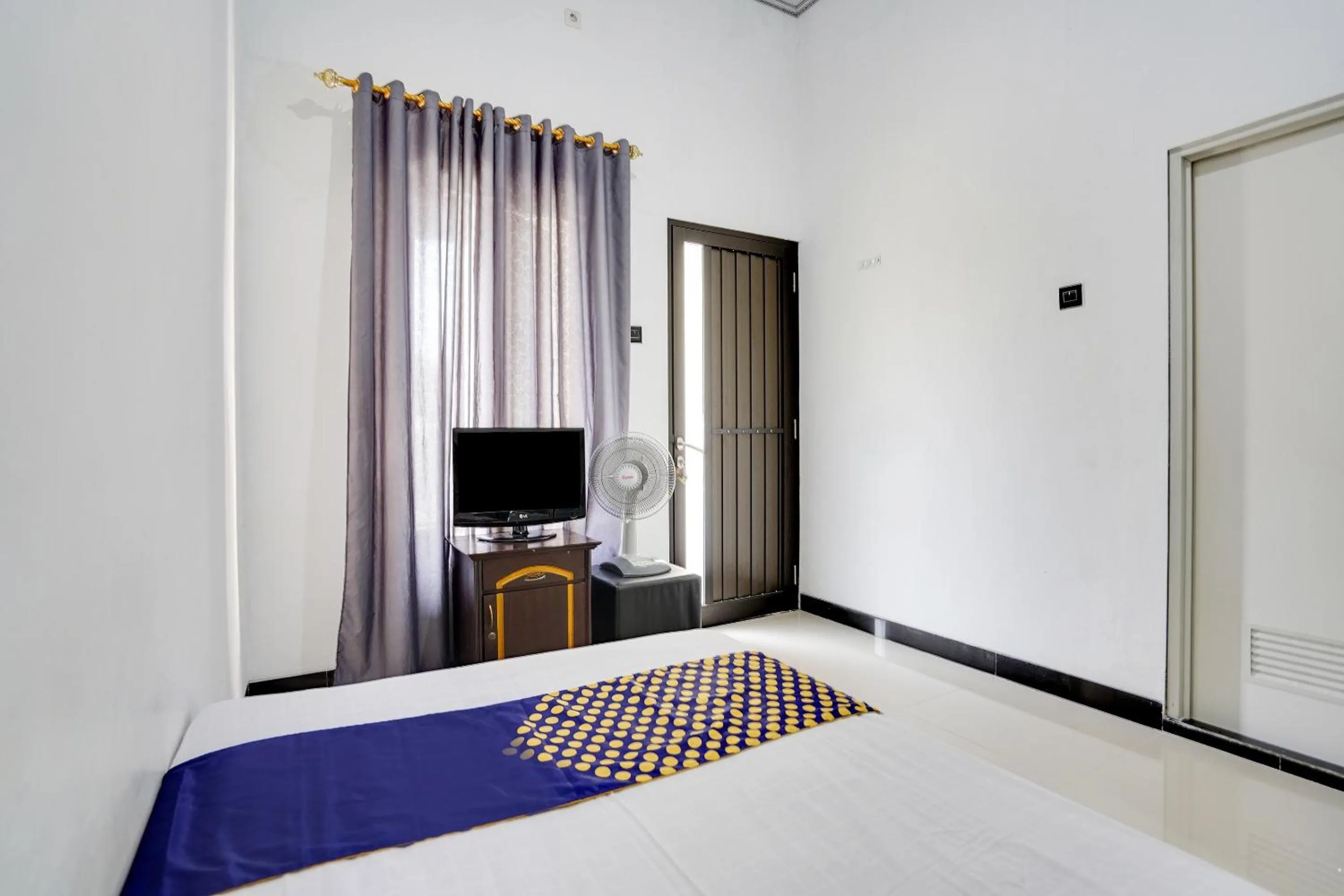 Bedroom in Hotel O Rumah Kost Gresik Syariah