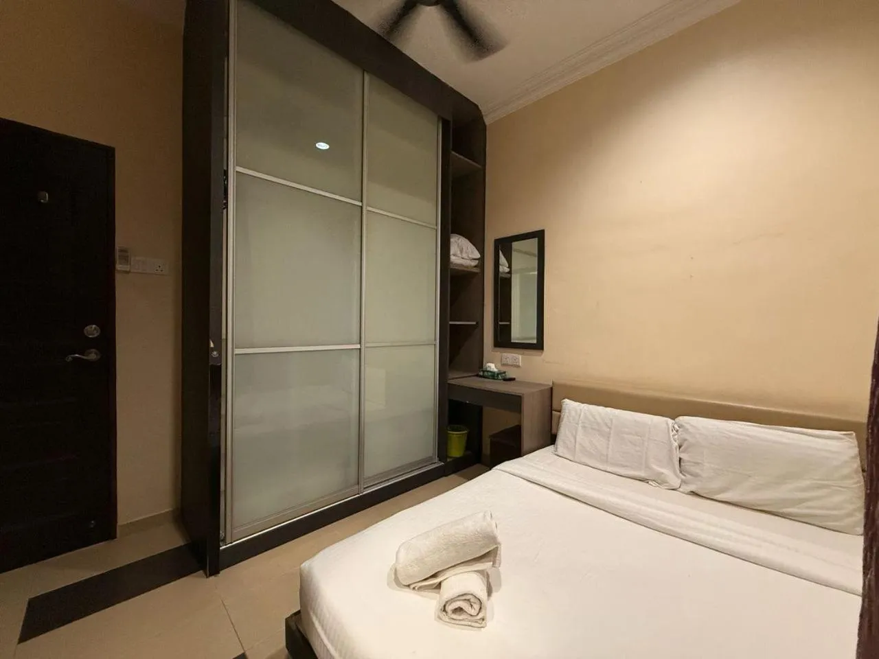 Bed in RNK BoutiQue HOTEL