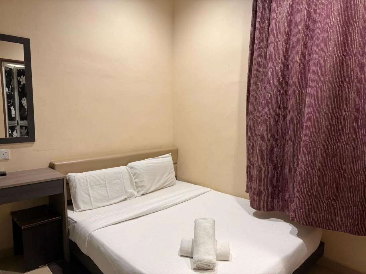 Bed in RNK BoutiQue HOTEL