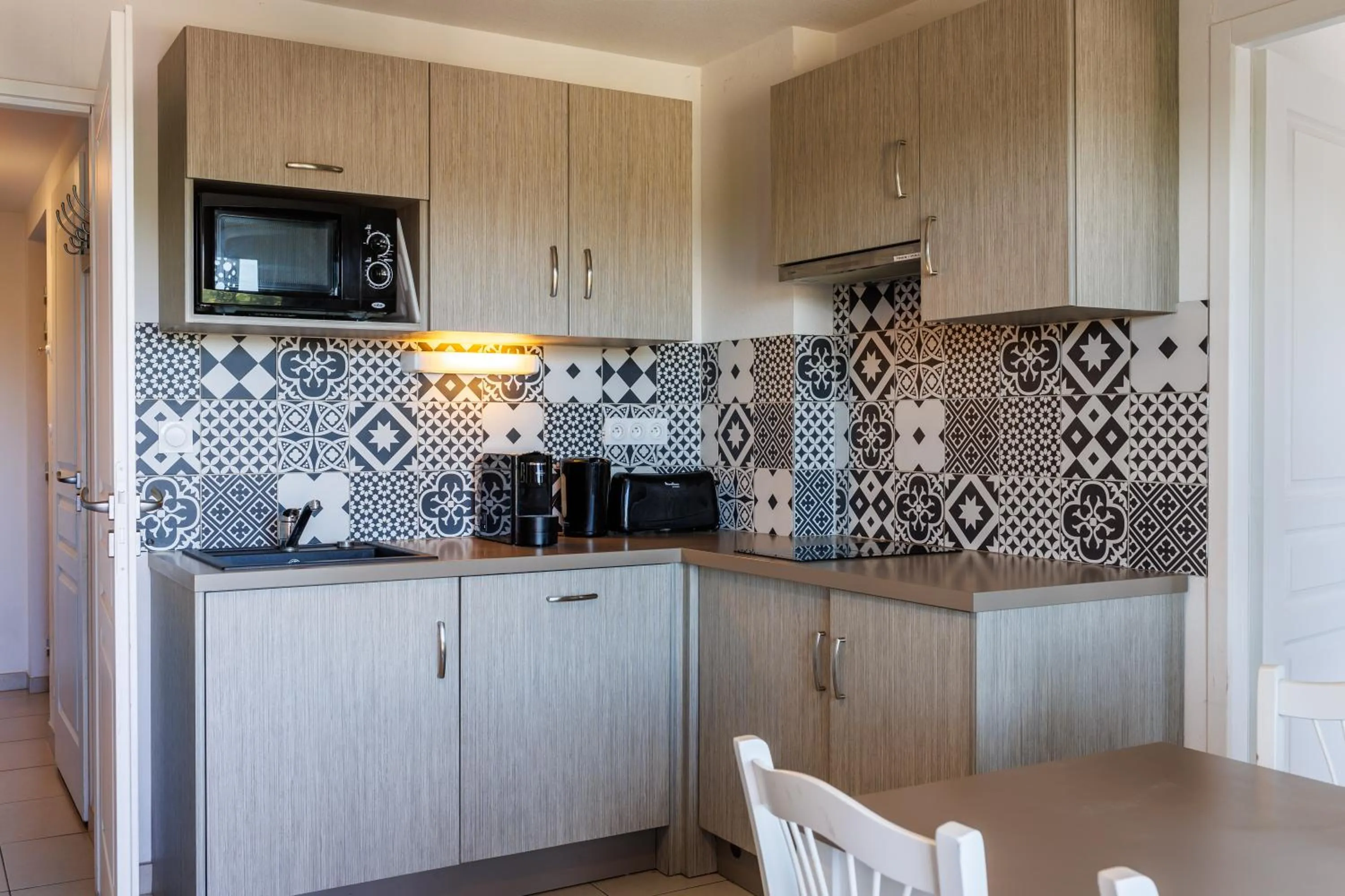 Kitchen or kitchenette in Residhotel Résidence Pont du Gard