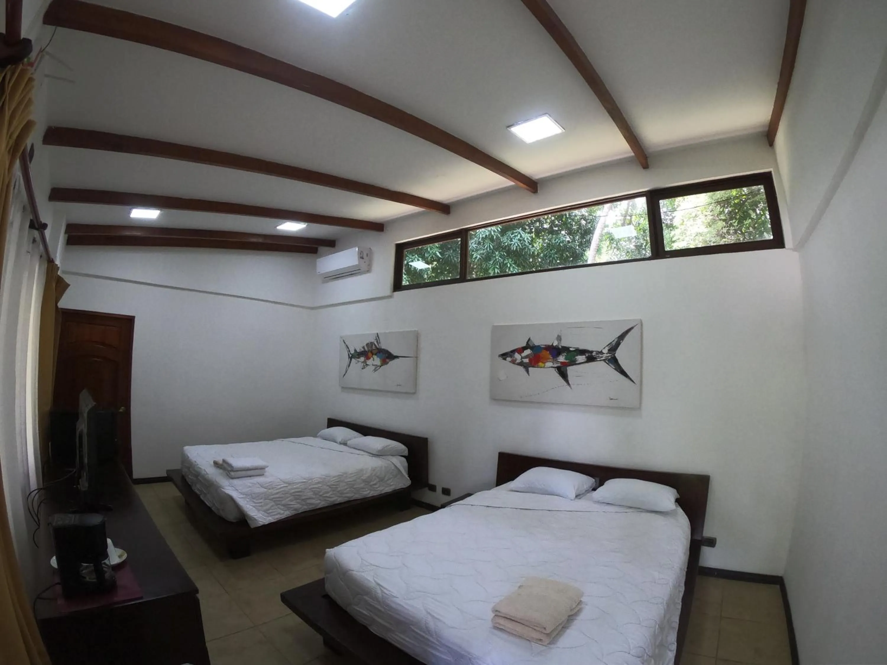 Property building, Bed in Café de Playa Beach Front Hotel