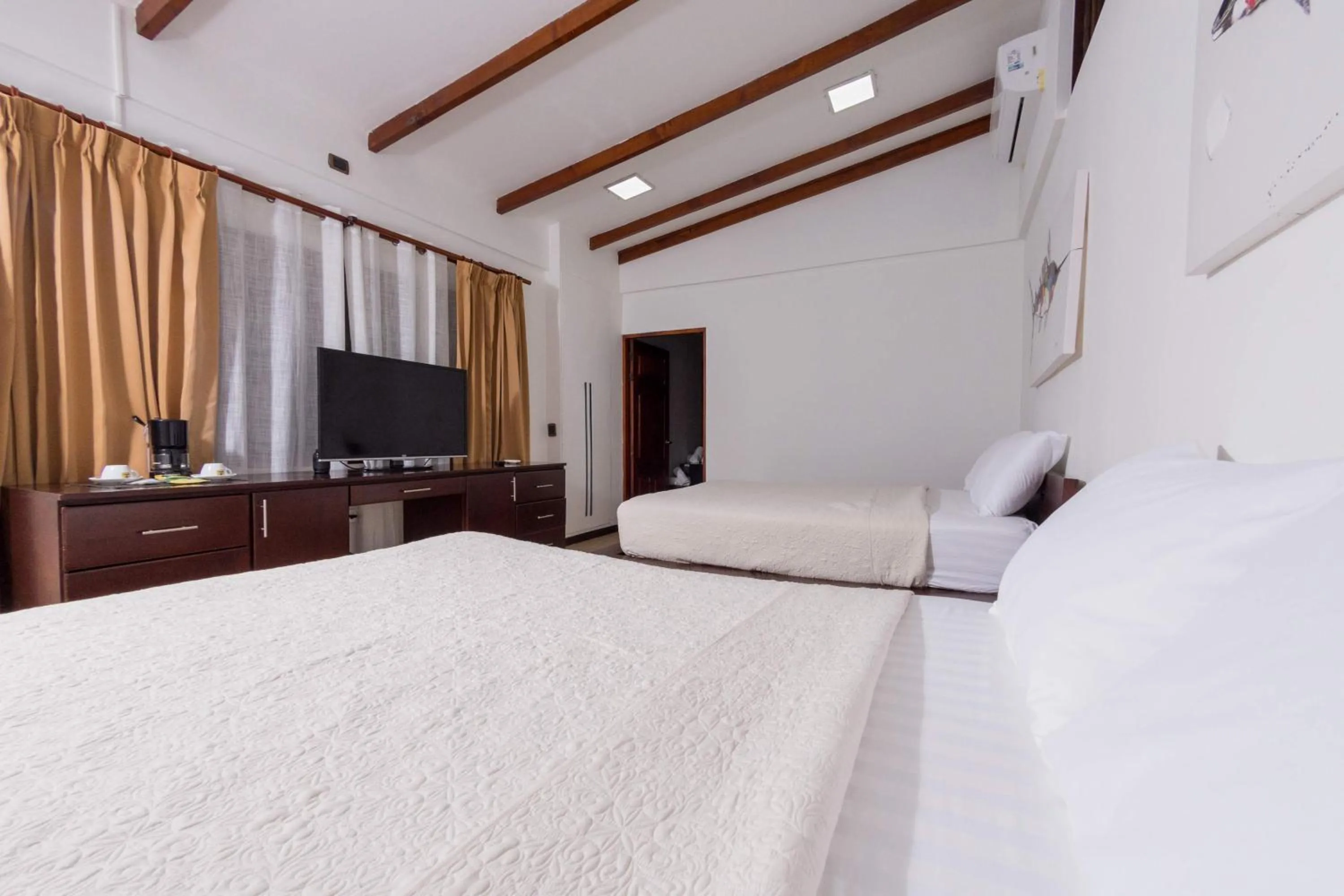 Bedroom, Bed in Café de Playa Beach Front Hotel