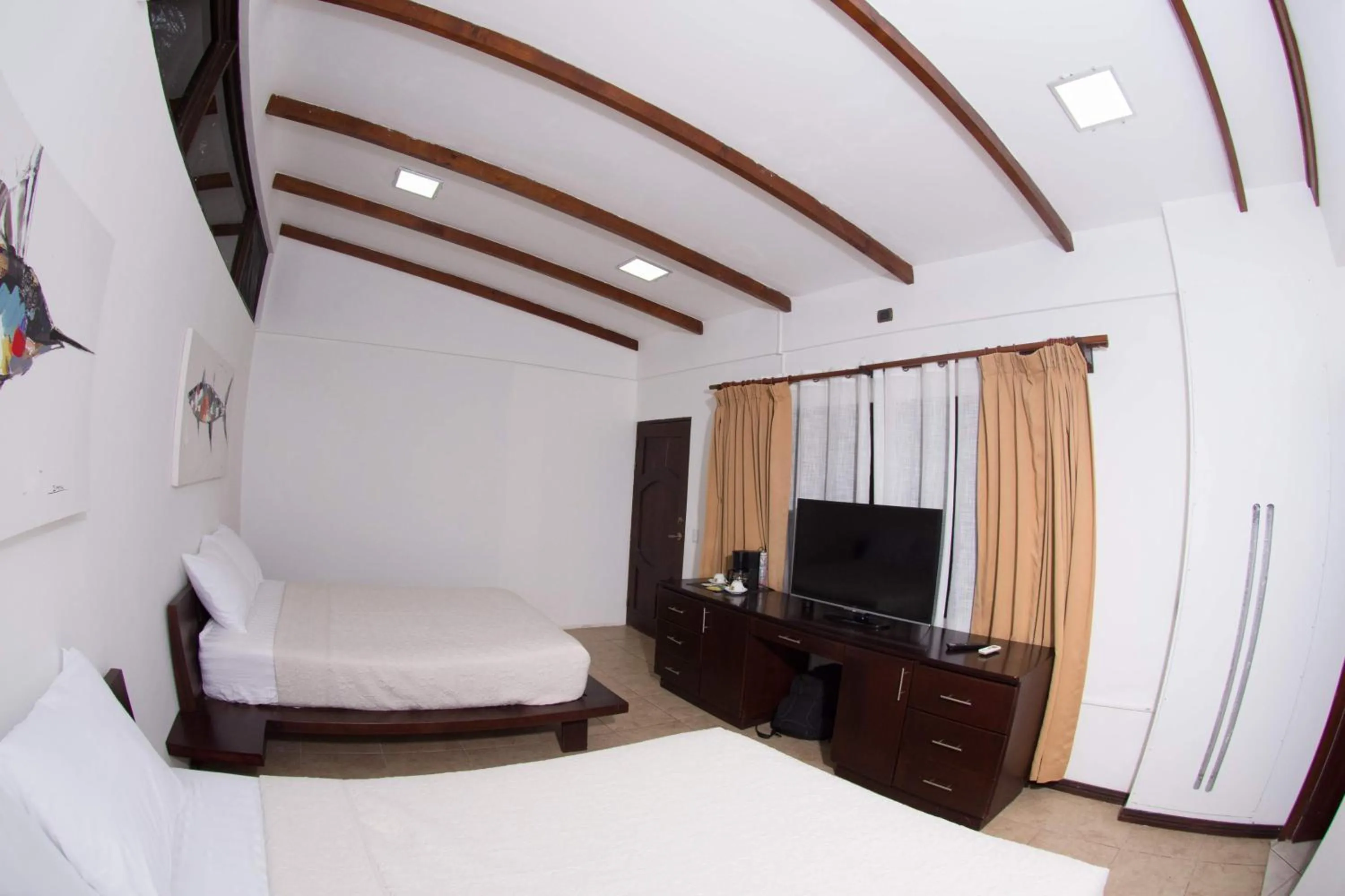 Bedroom, Bed in Café de Playa Beach Front Hotel