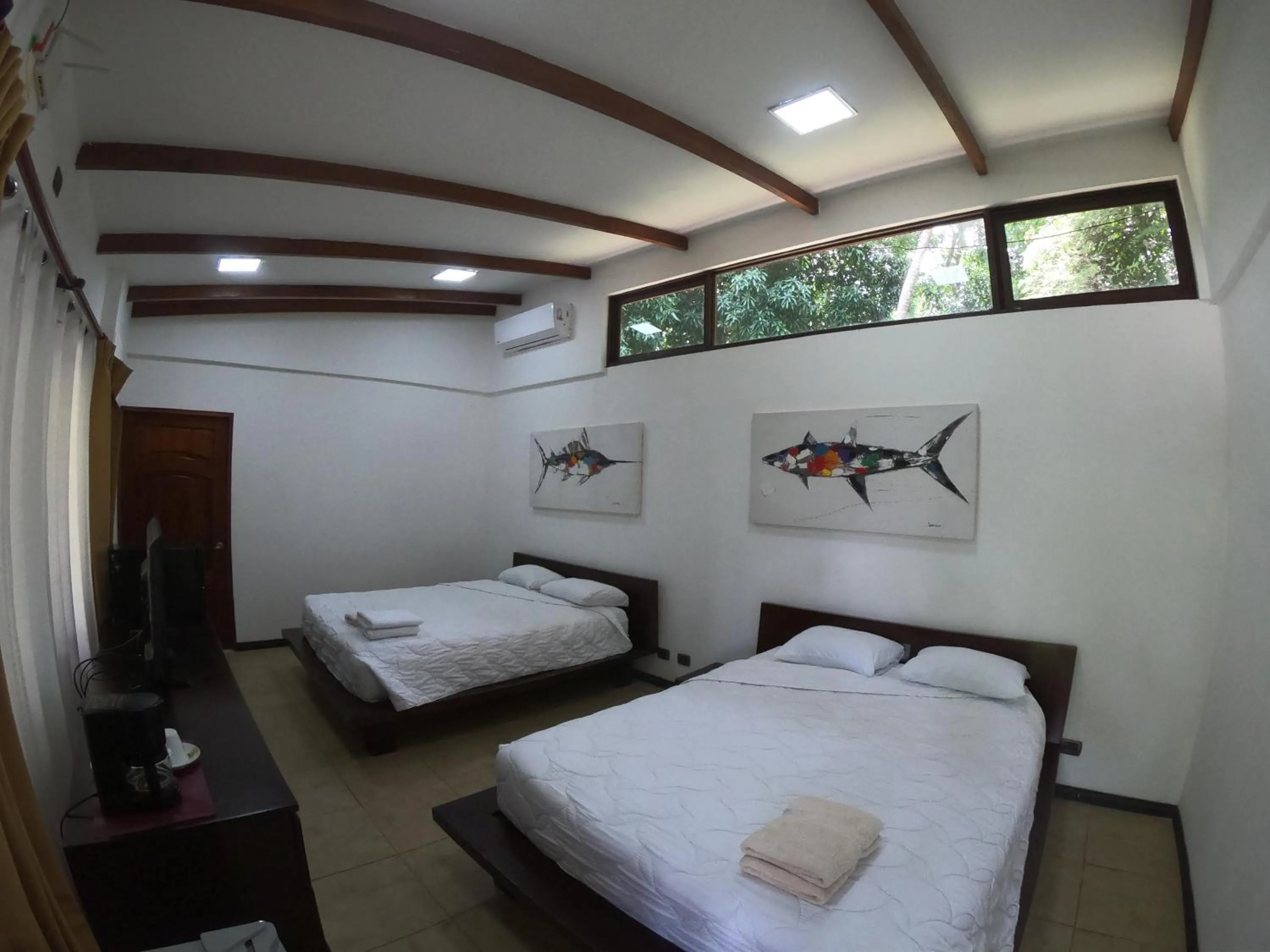 Property building, Bed in Café de Playa Beach Front Hotel