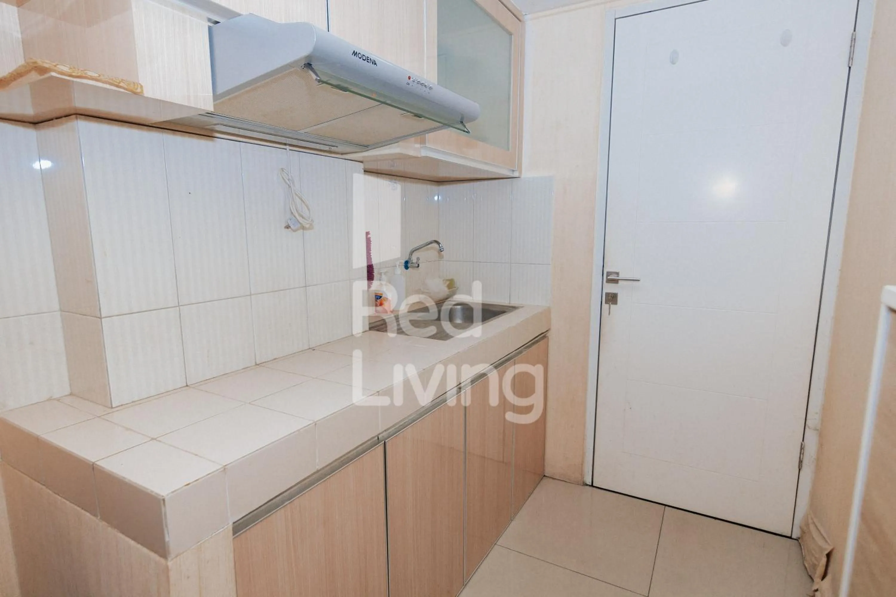 Kitchen or kitchenette in Redliving Apartemen Grand Sentraland - AT Properti Tower Pink