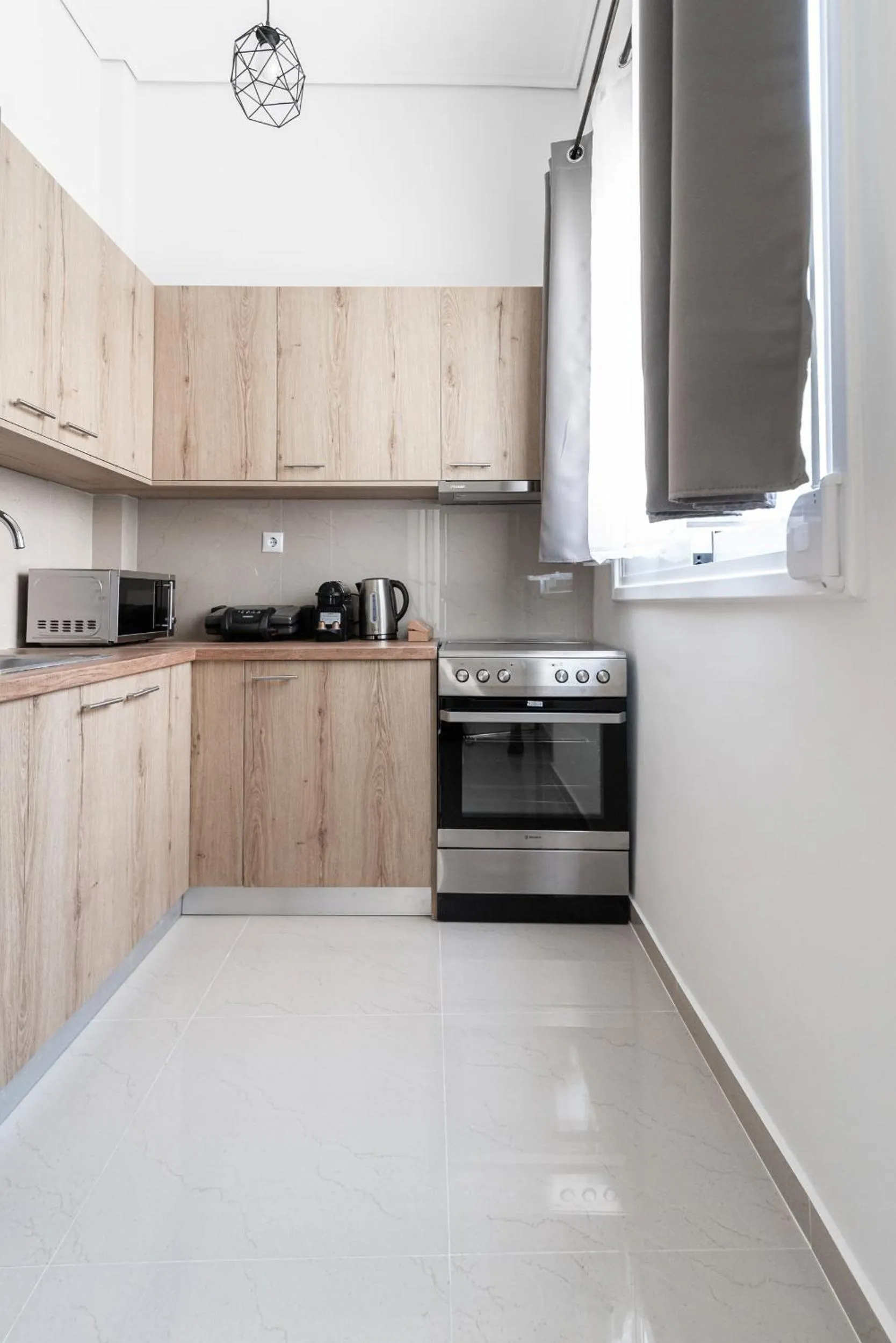 Kitchen or kitchenette in Blue Riviera villas & suites - Alimos 2