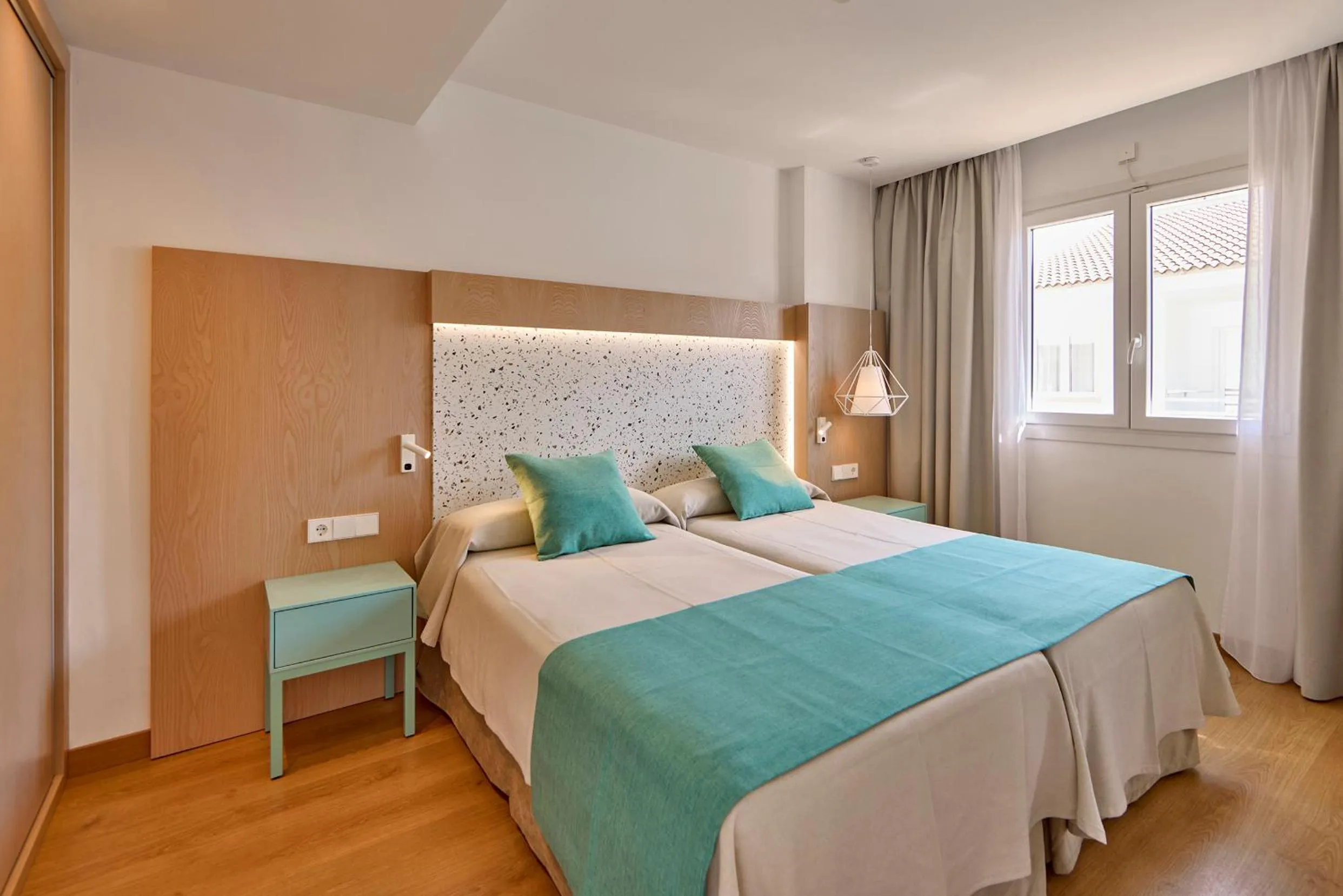 Bed in Universal Aparthotel Elisa