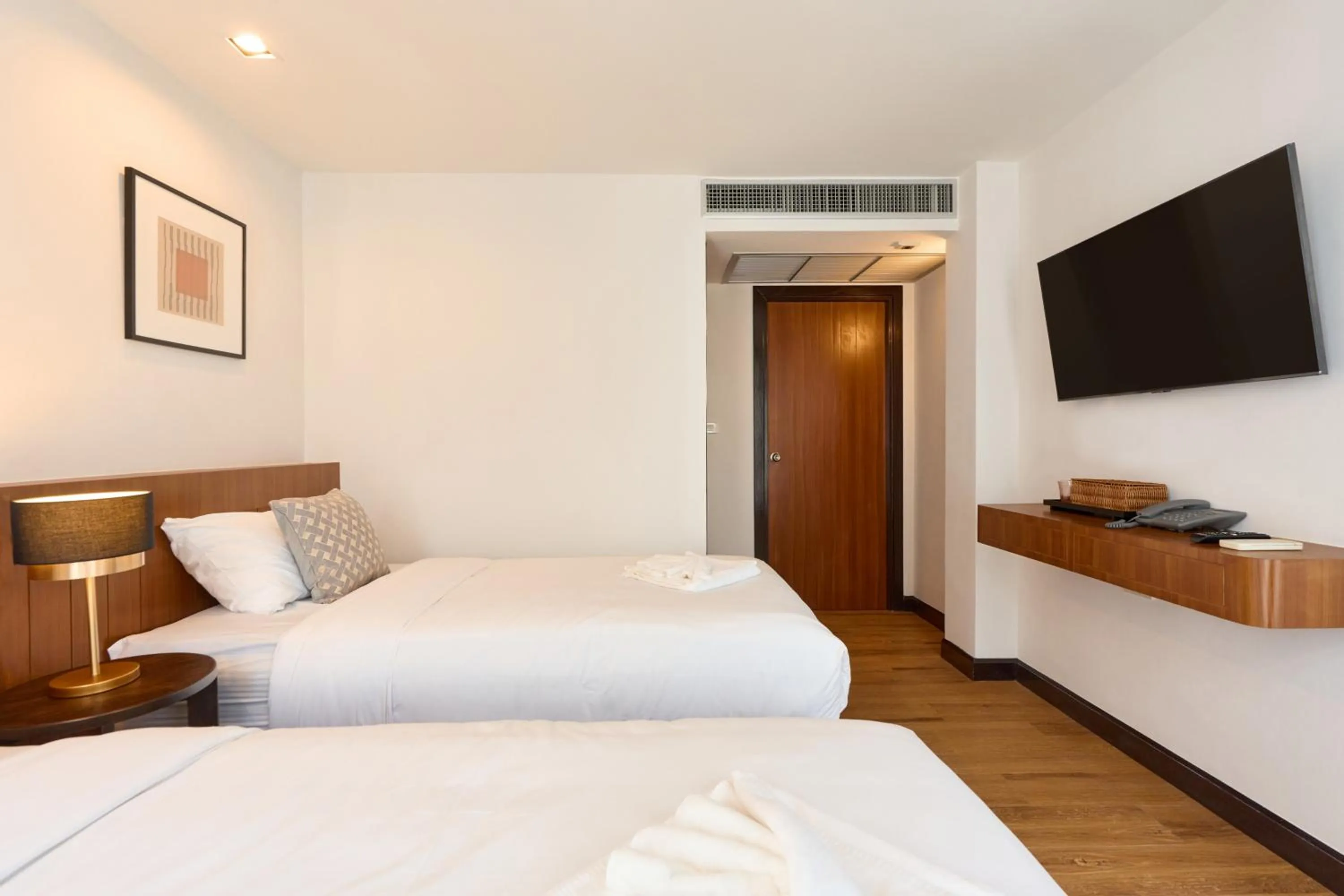 Bed in Be Phrasingh Hotel Chiang Mai