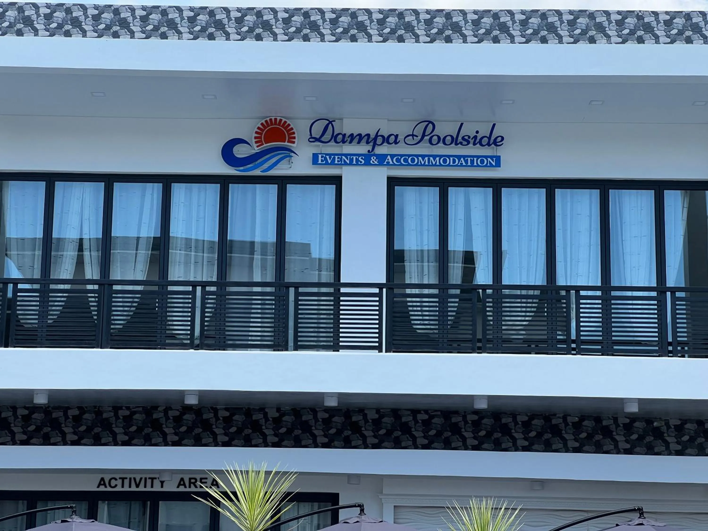 Property logo or sign in Dampa Poolside Events & Accommodation
