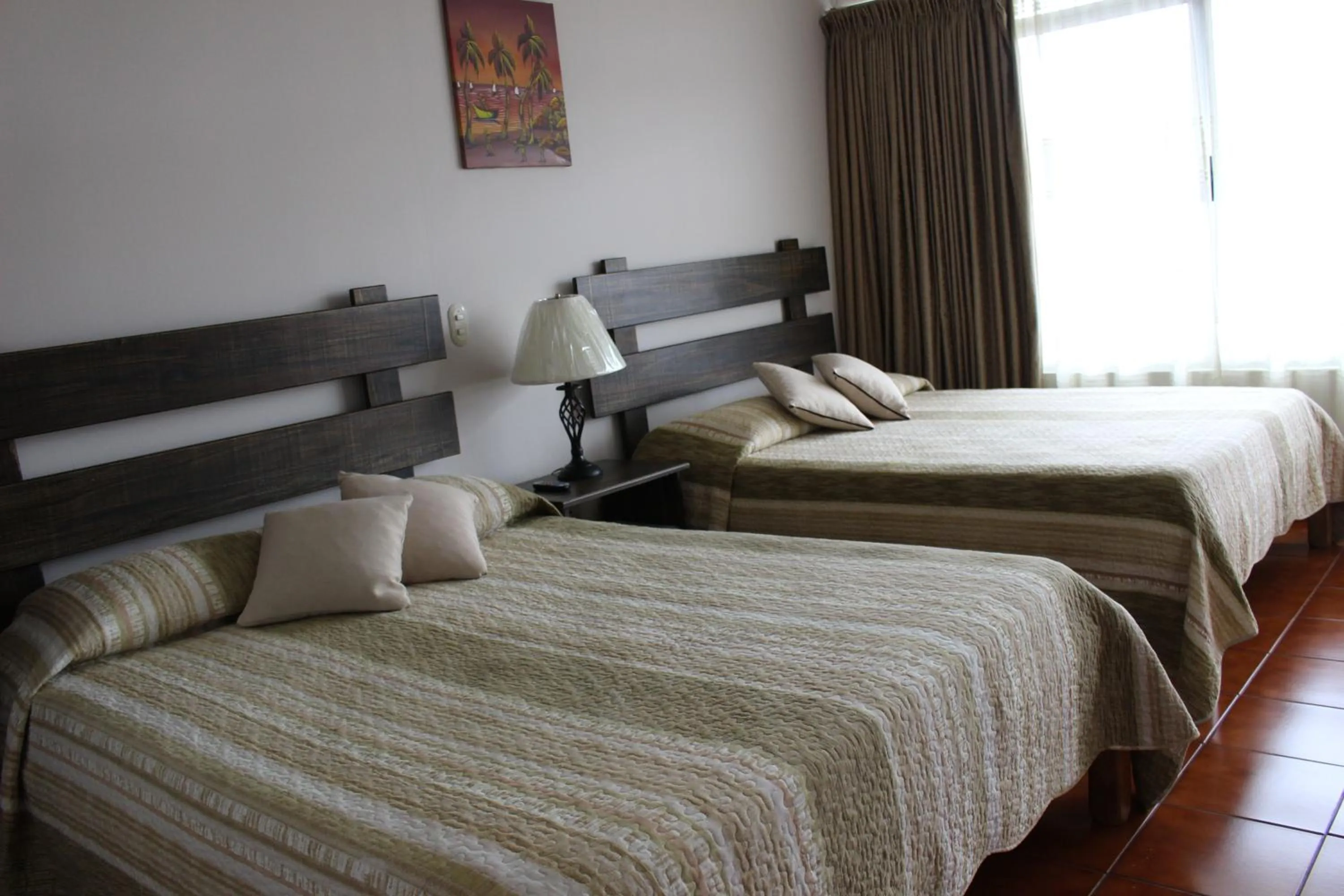 Photo of the whole room, Bed in Hotel Arenal by Regina
