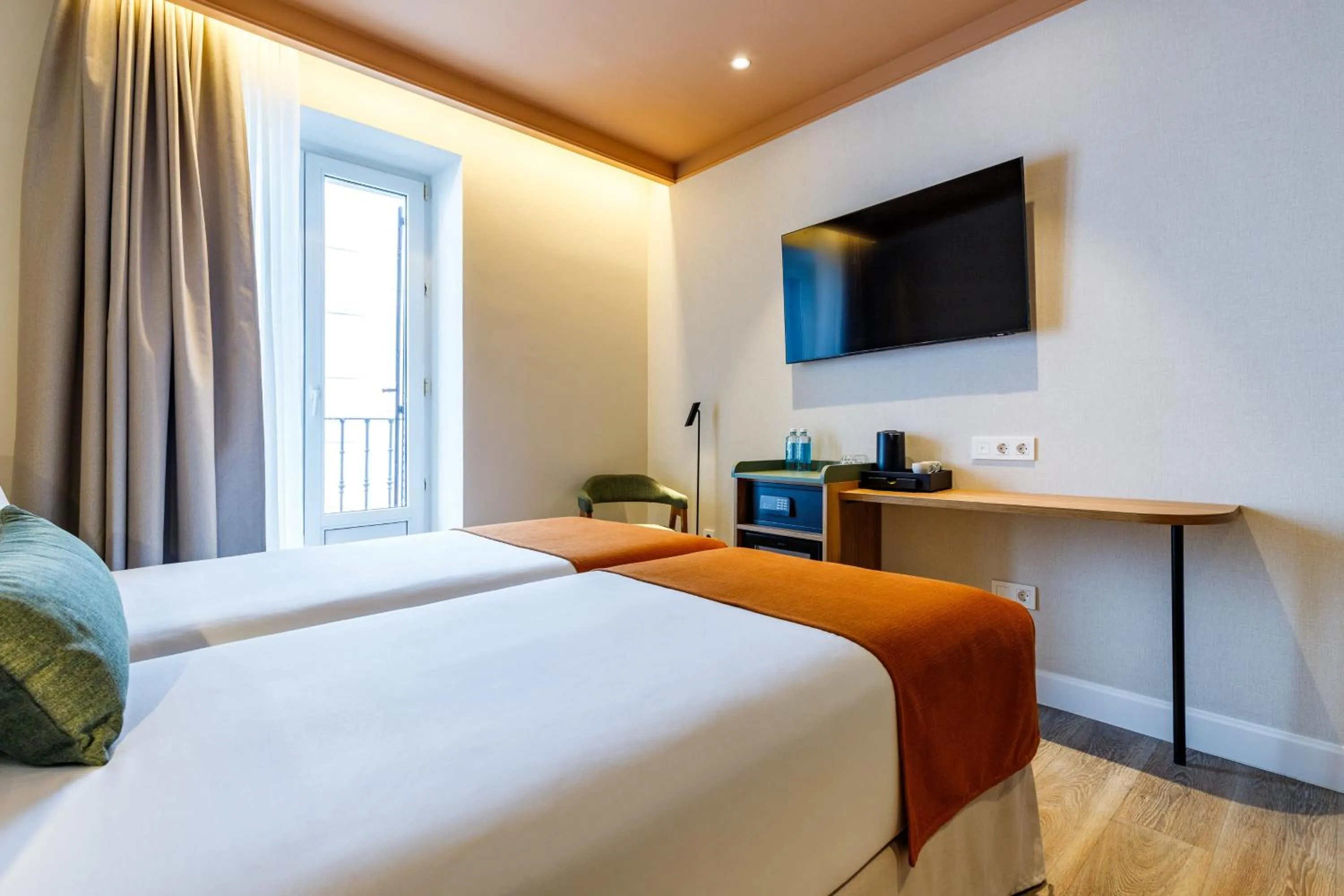 Bed in Petit Palace Puerta del Sol