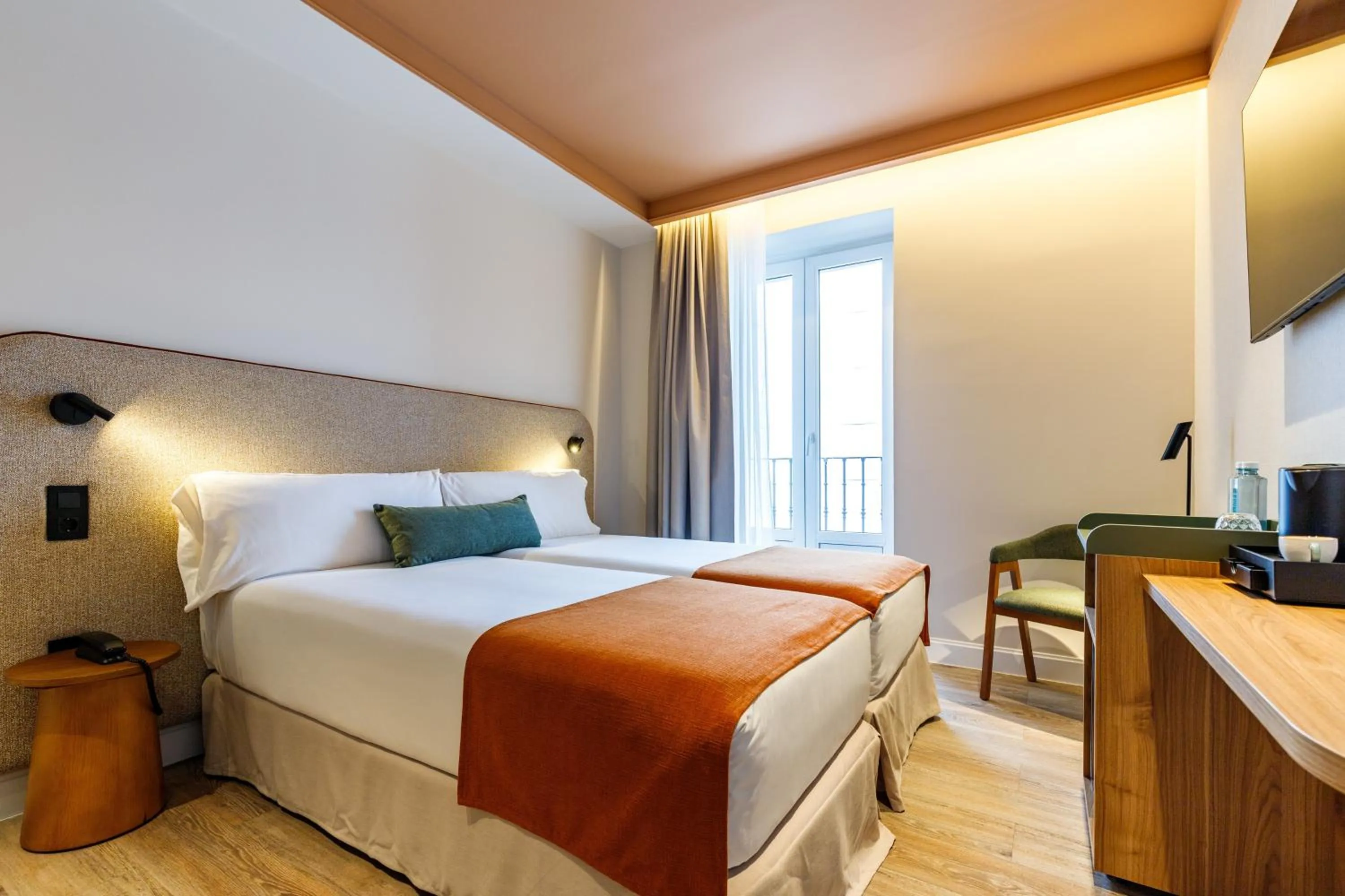 Bed in Petit Palace Puerta del Sol