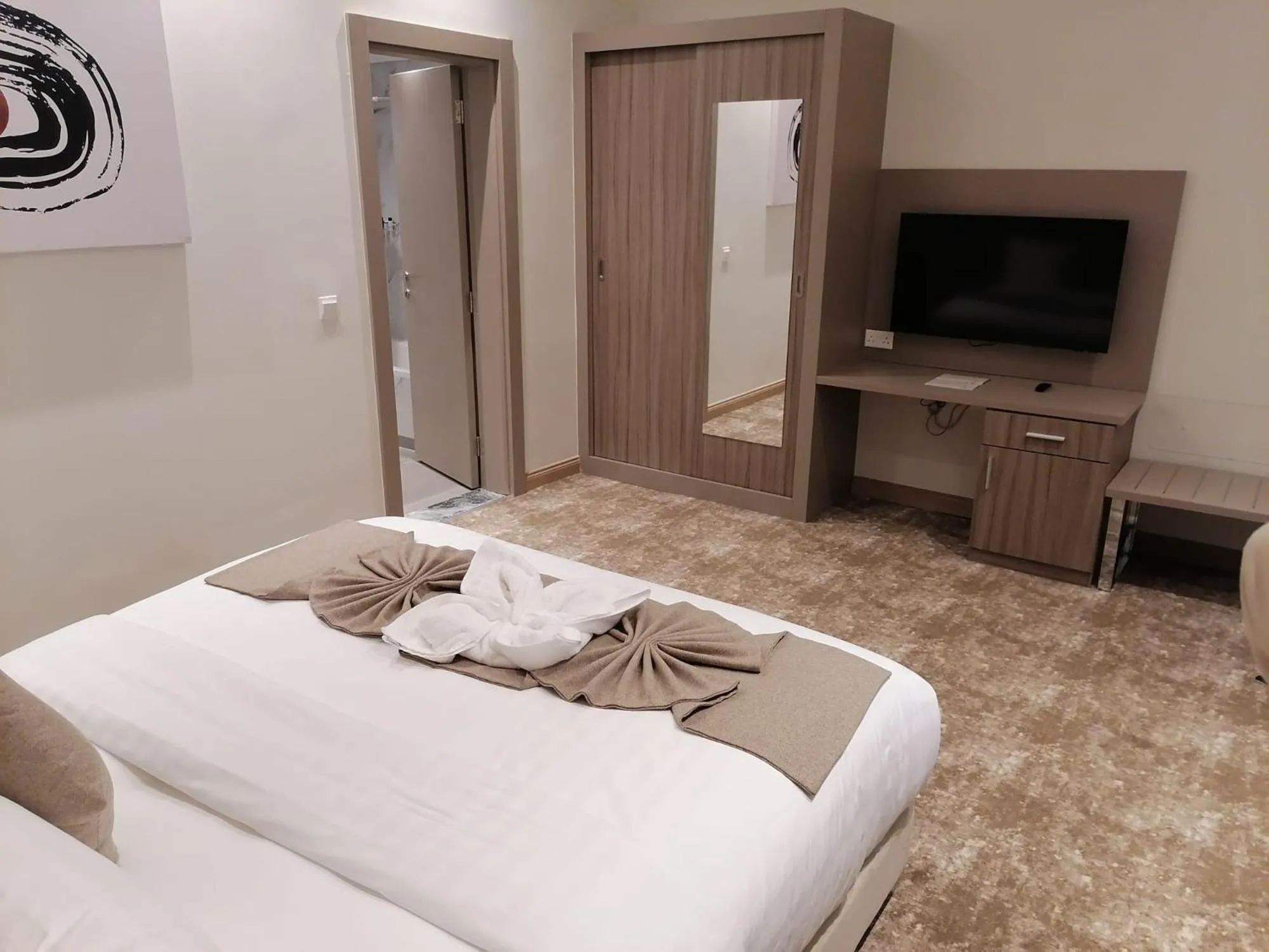 Bed in Gloria Hotel & Suites Doha