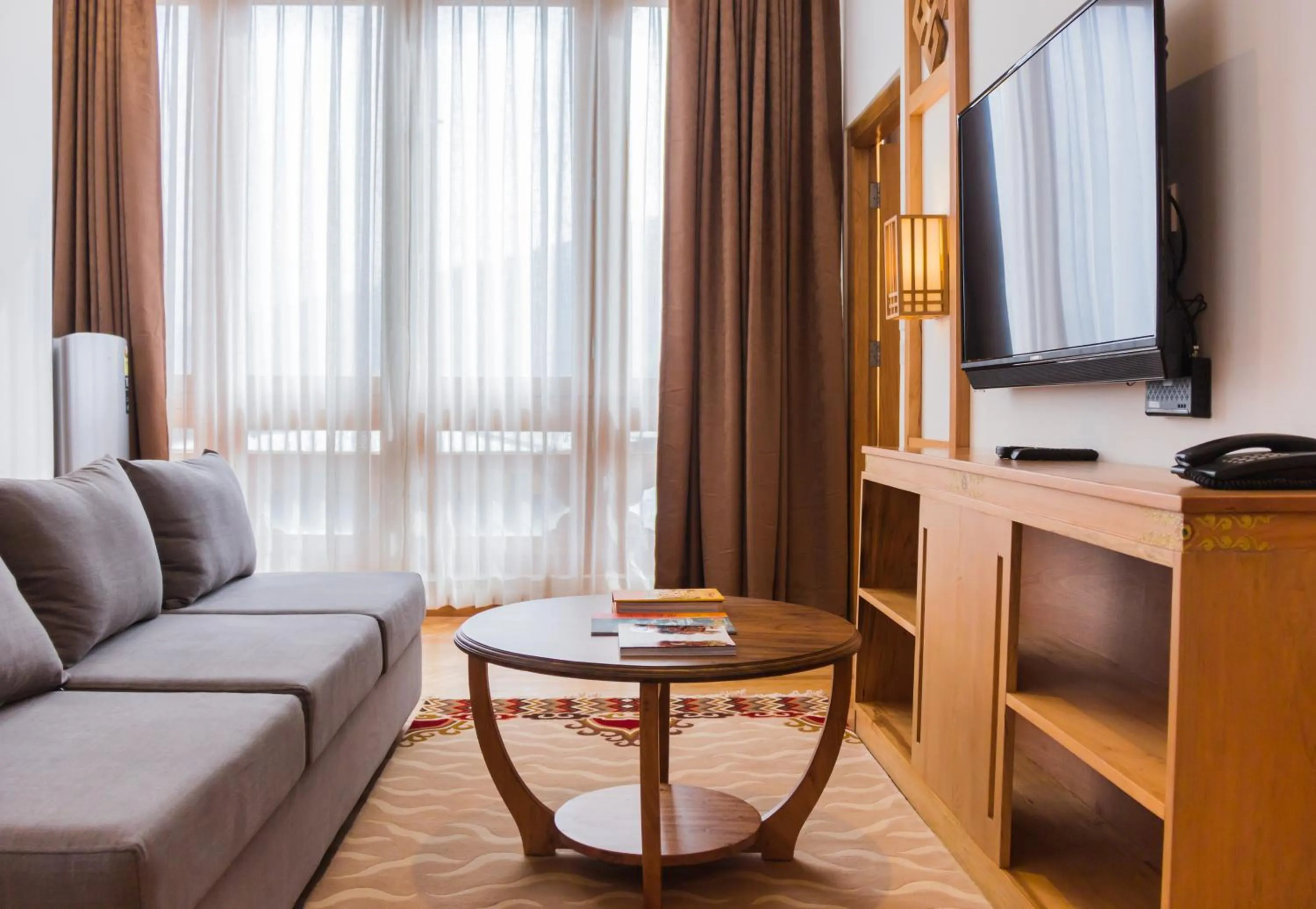 Communal lounge/ TV room in Pelyang Boutique
