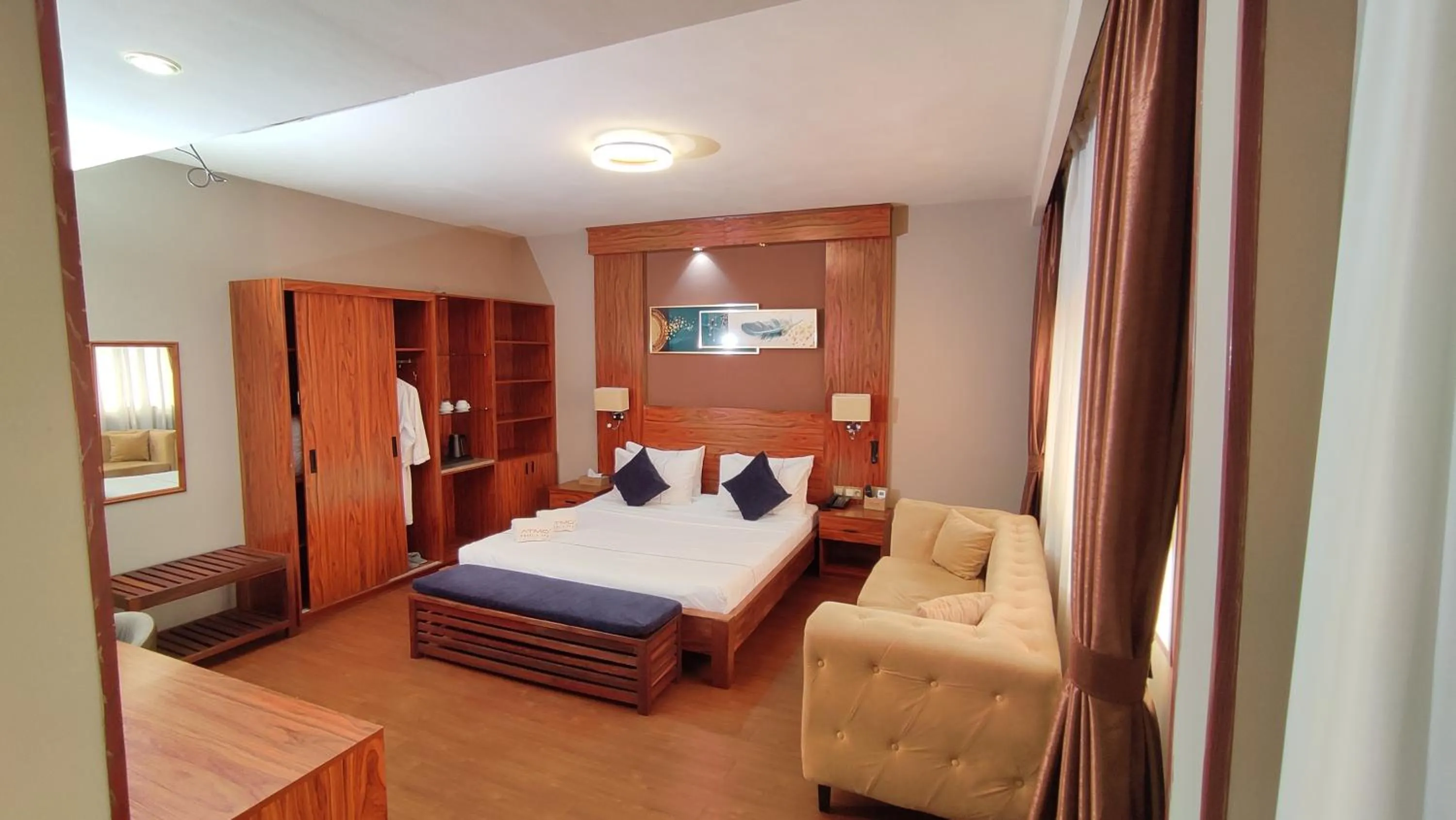 Bed in Atmosphere Hotel & Spa