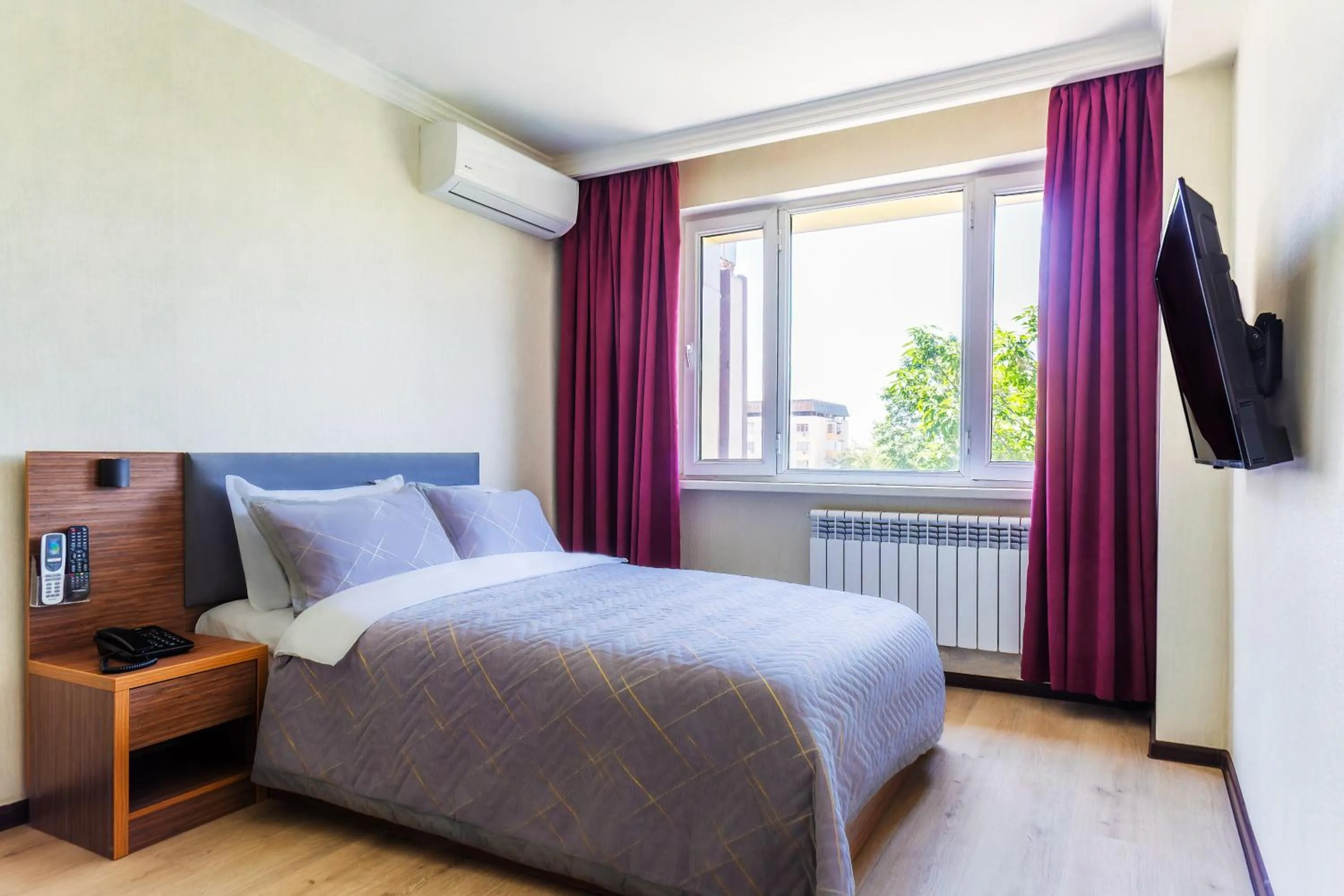 Bed in CENTRAL ASİA HOTEL