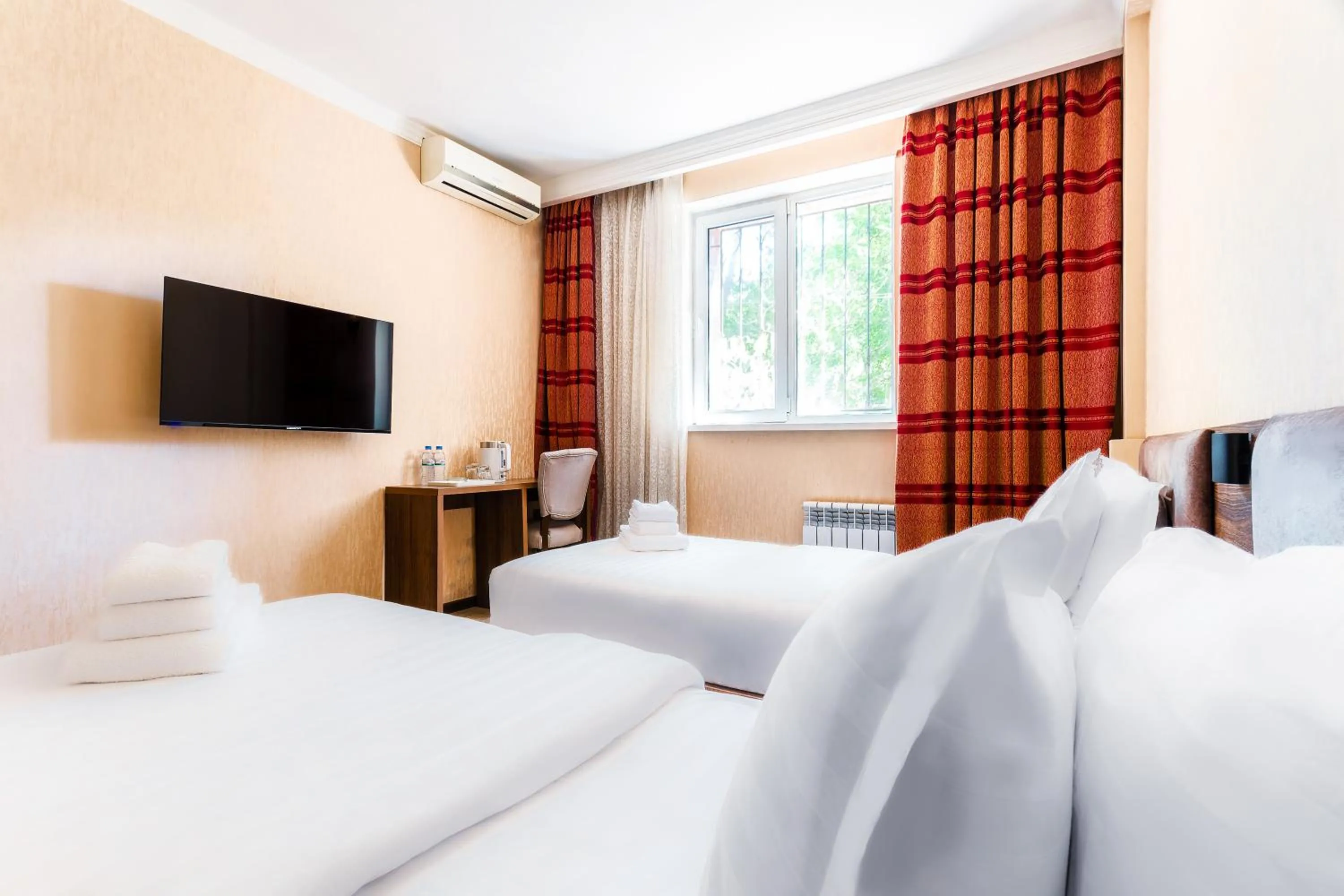 Bed in CENTRAL ASİA HOTEL