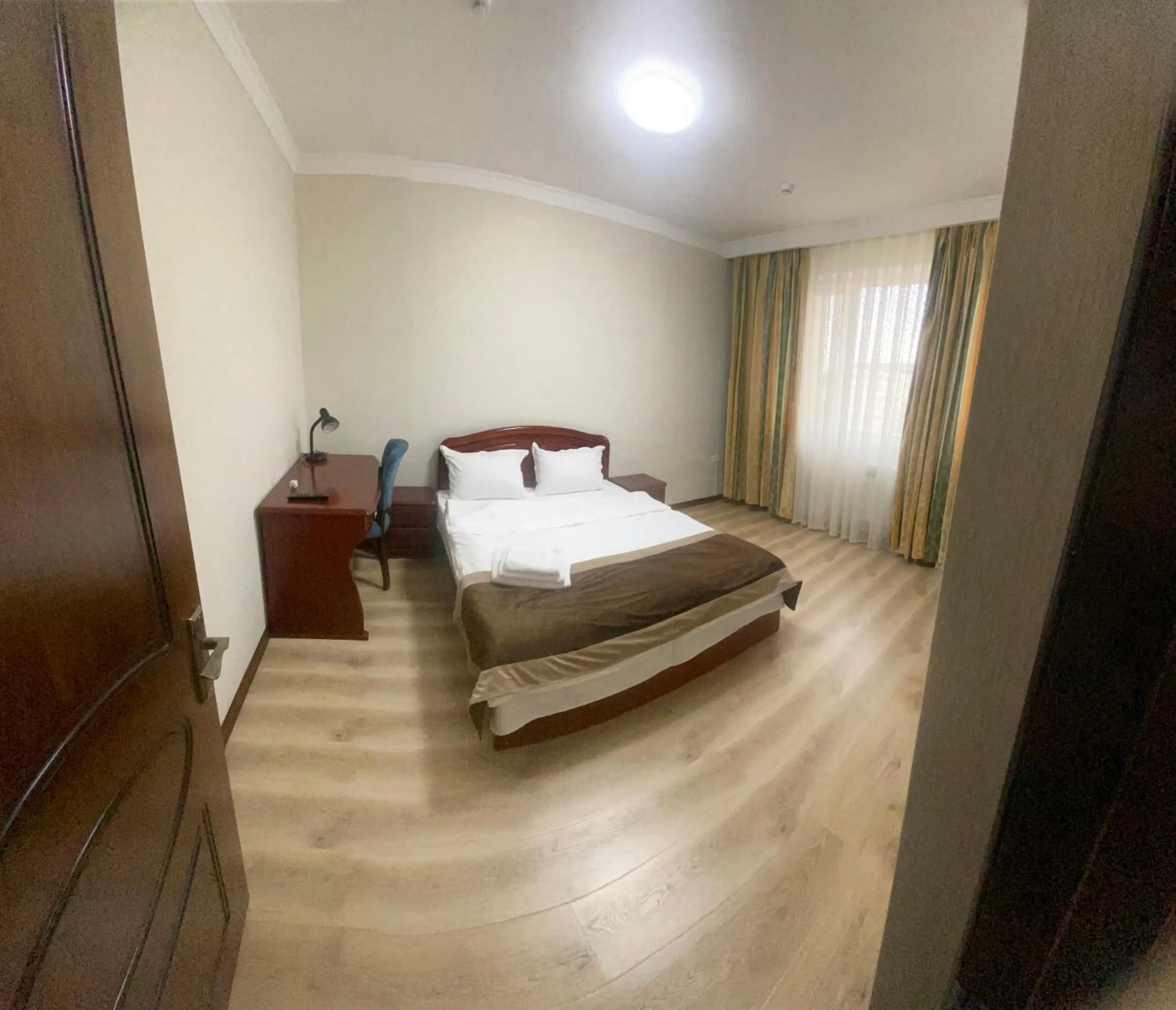 Bed in CENTRAL ASİA HOTEL