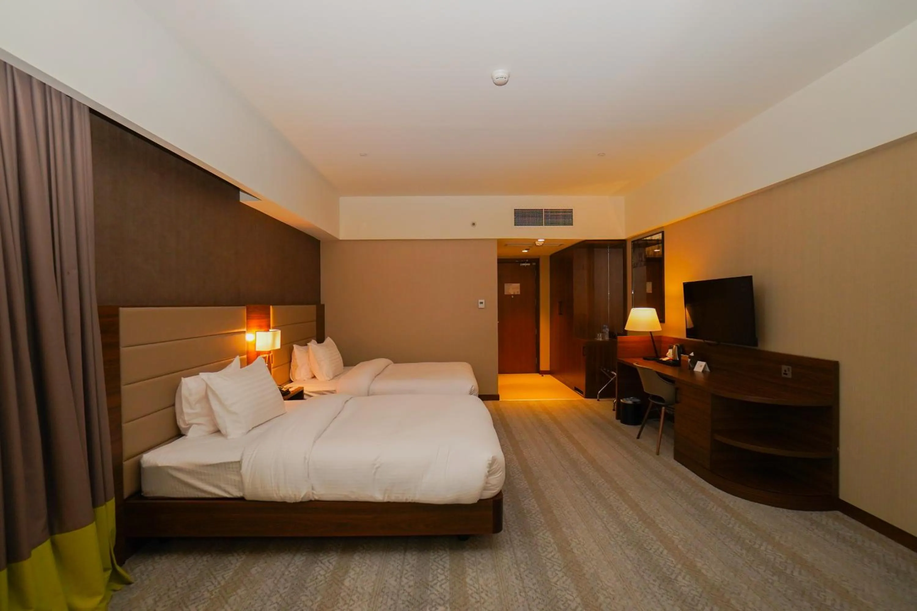 Bed in The Grand Lux Hotel