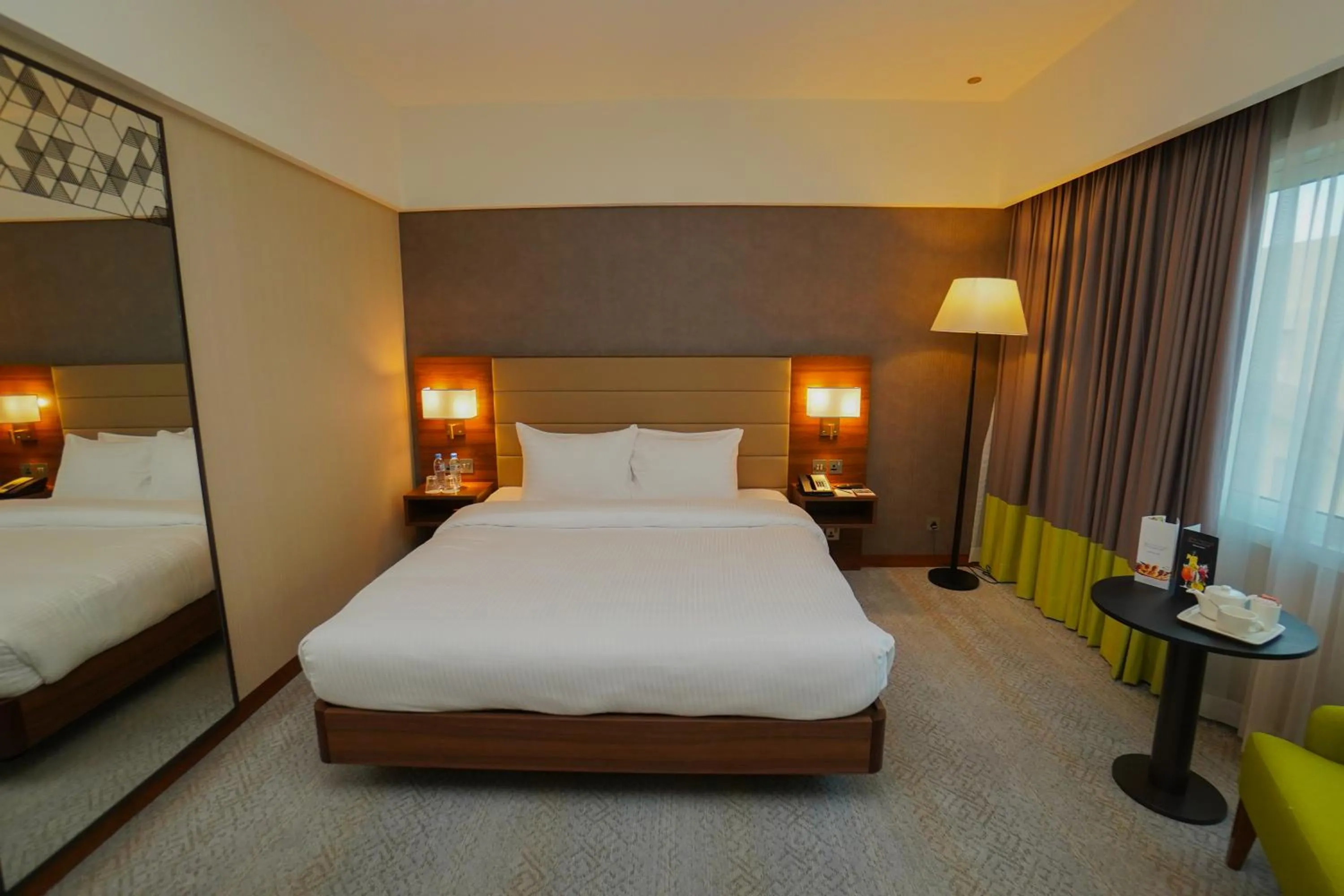 Bed in The Grand Lux Hotel