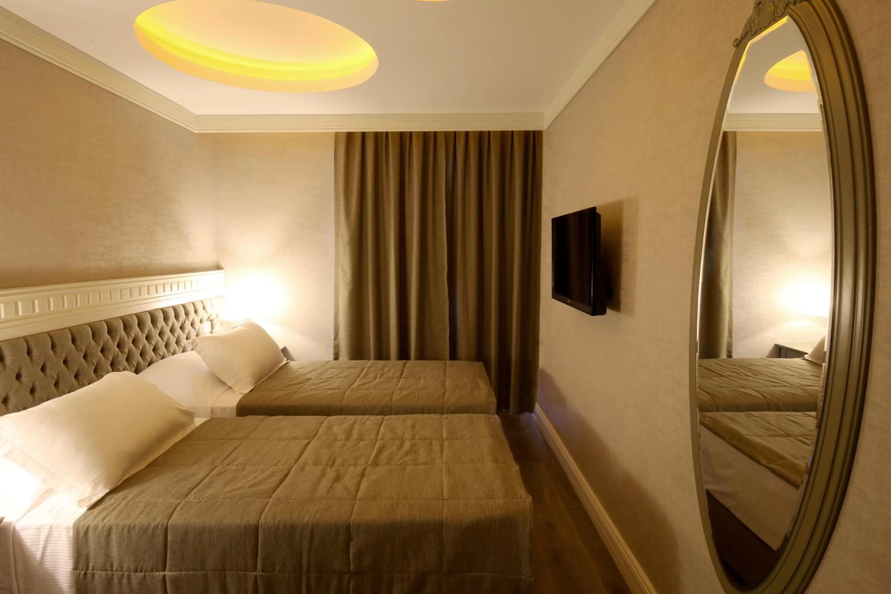 Bed in Pinehill Hotel & Suites