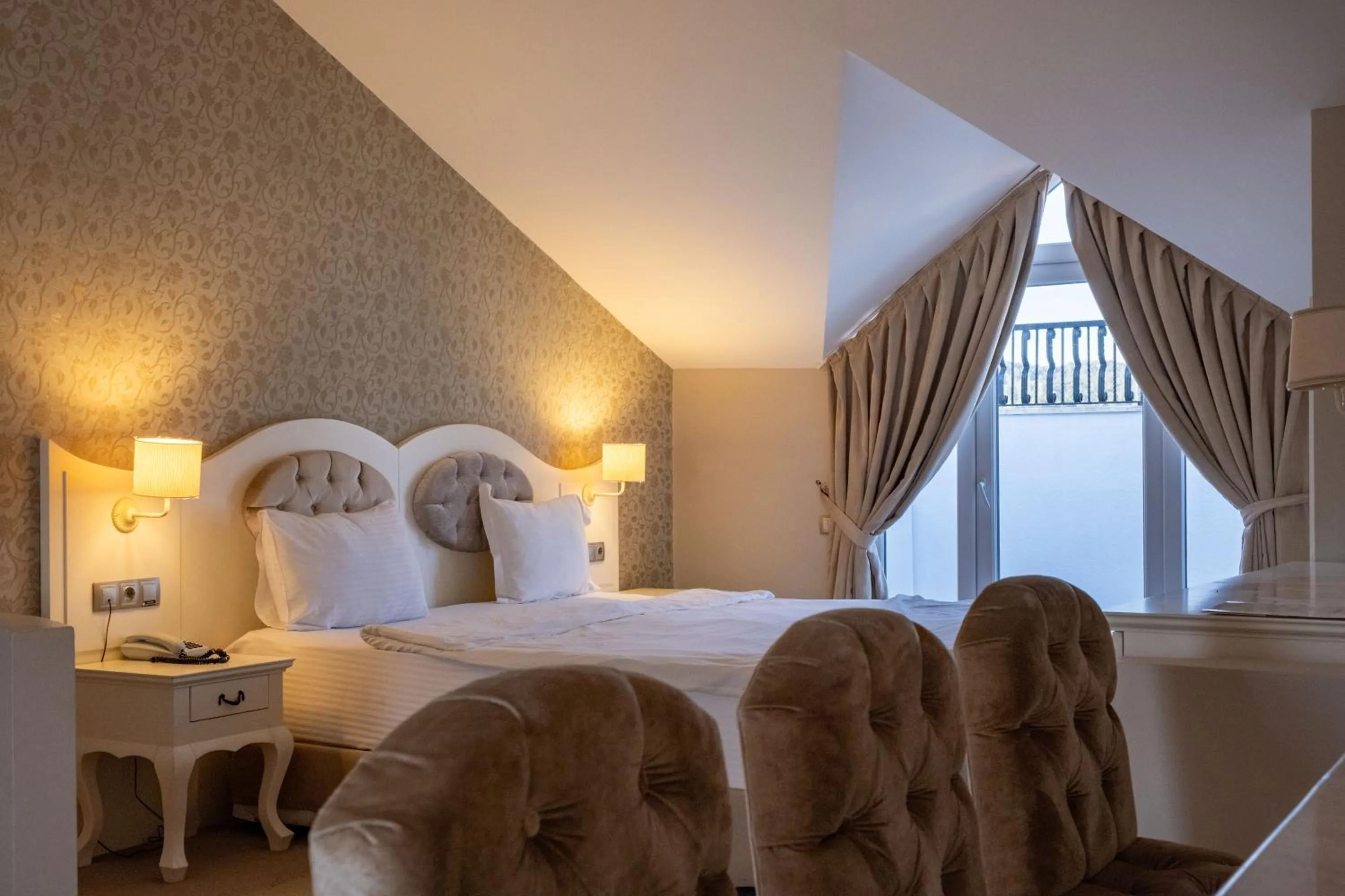 Bed in Pinehill Hotel & Suites