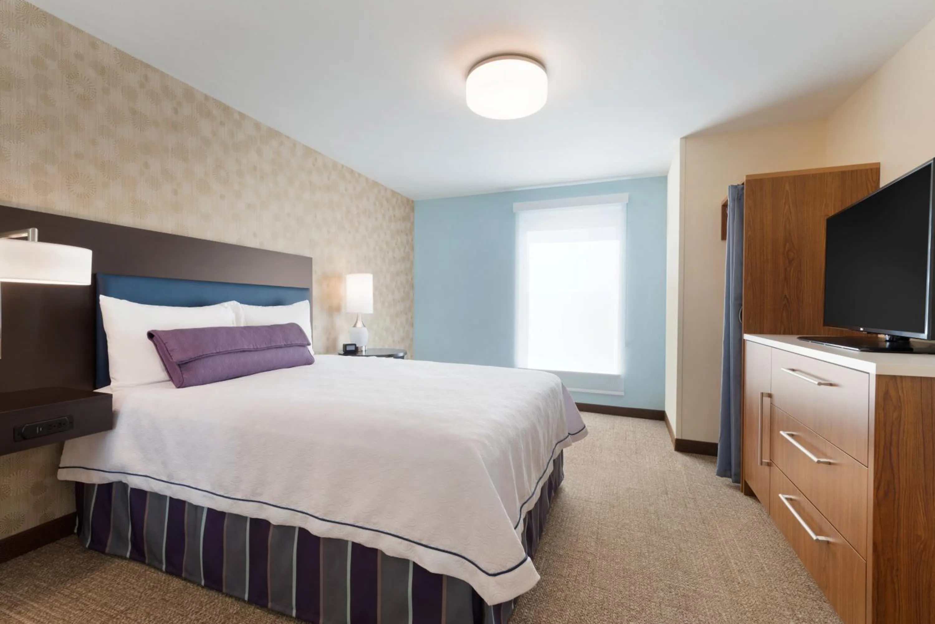 Bed in Home2 Suites by Hilton Fargo