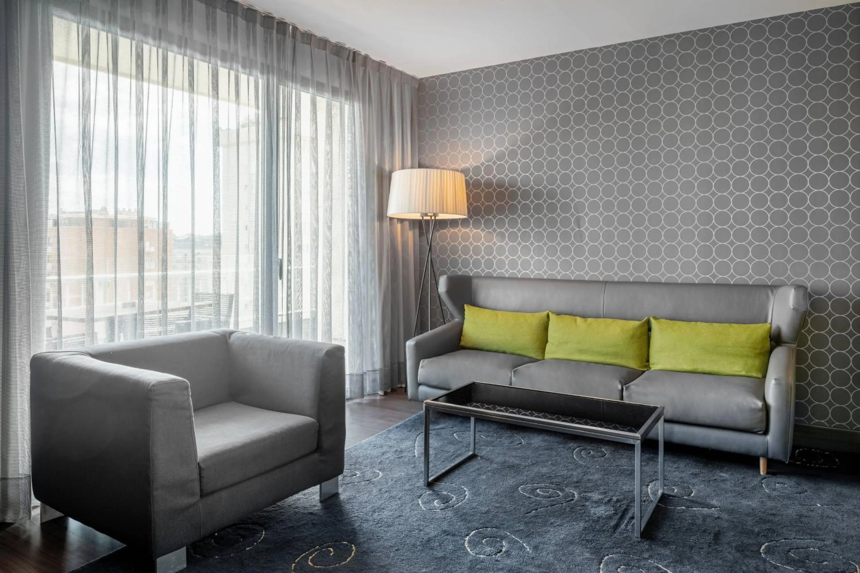 Living room in AC Hotel Victoria Suites by Marriott