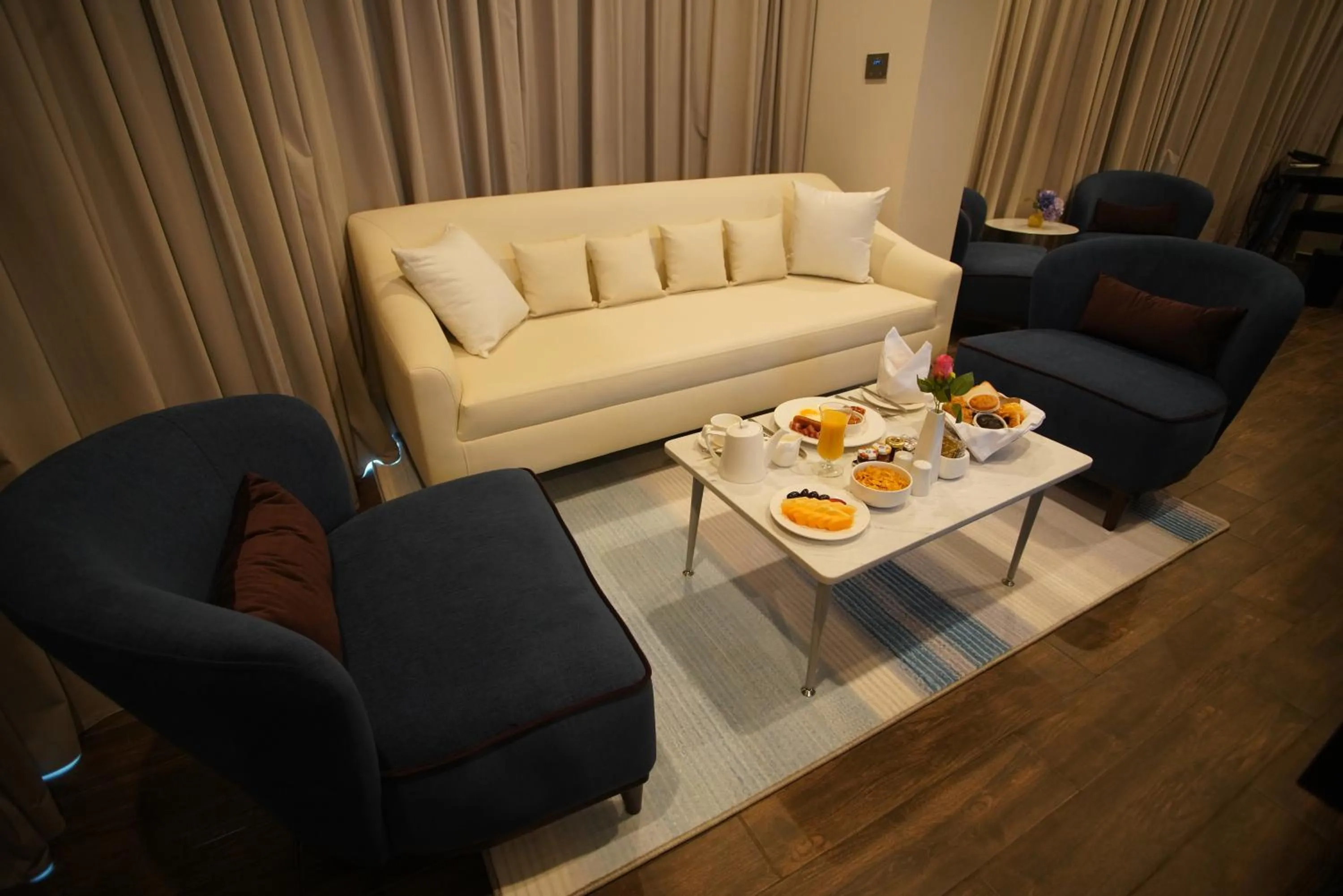 Seating area in C - Hotel and Suites Doha