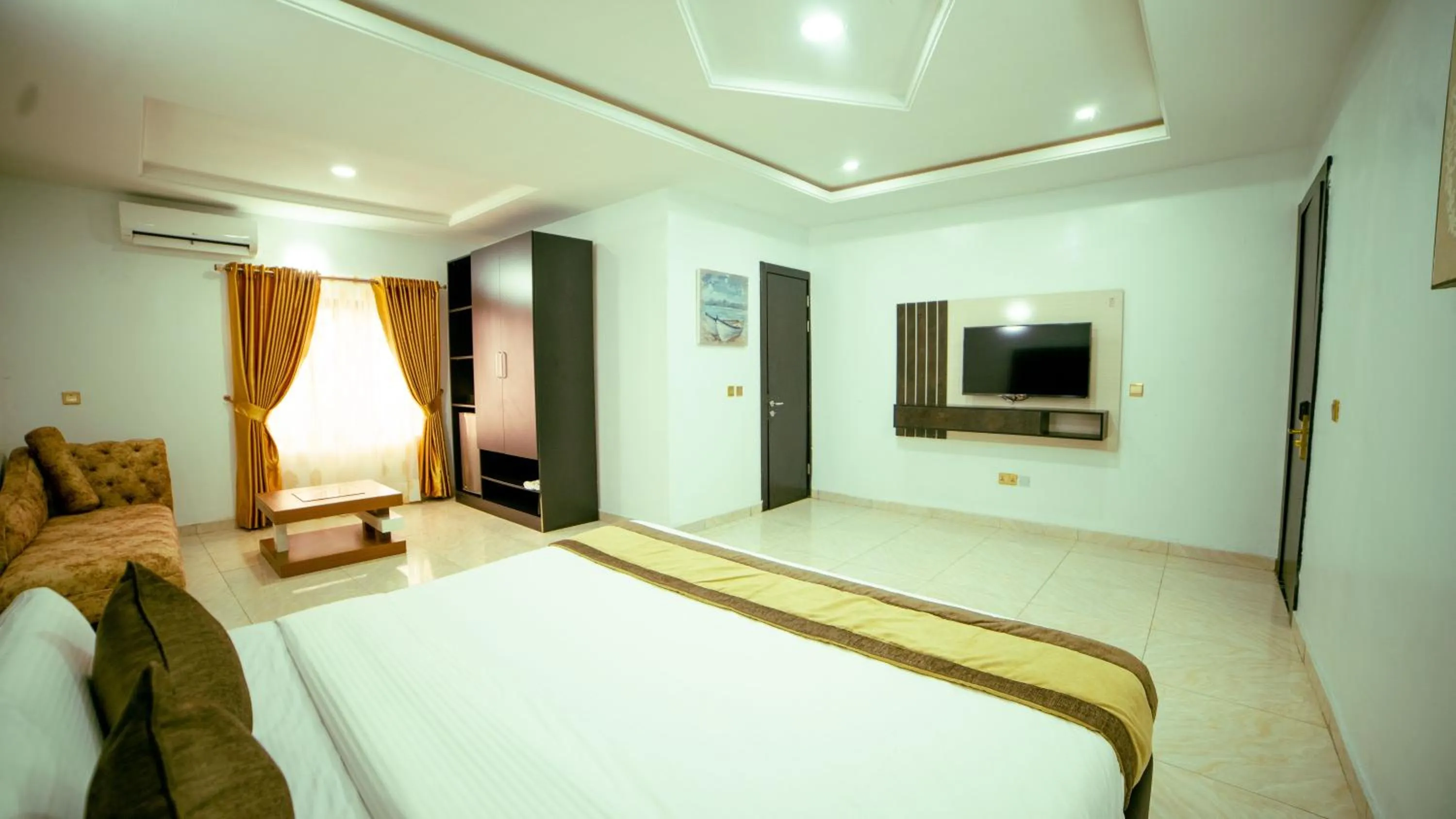 Communal lounge/ TV room, Bed in 247 Luxury Hotel & Apartment Ajah