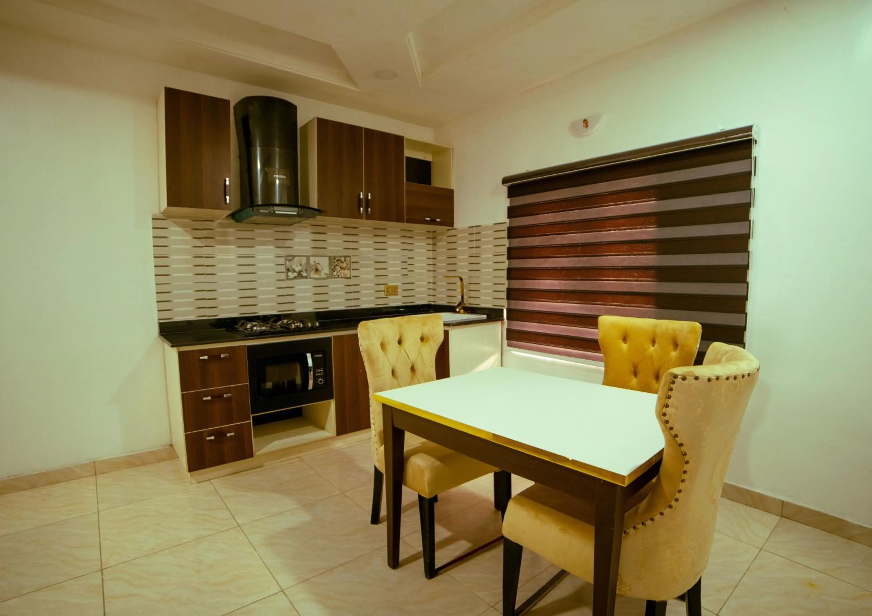 Kitchen or kitchenette in 247 Luxury Hotel & Apartment Ajah