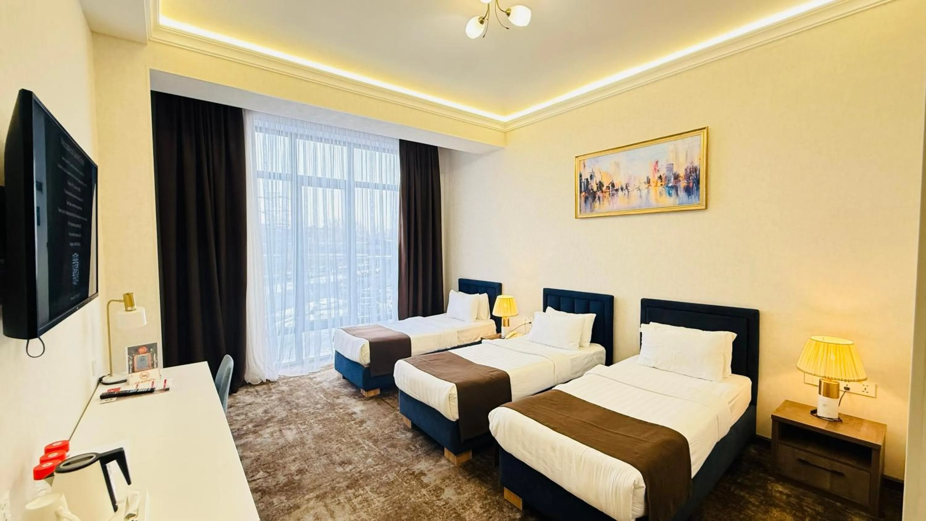 Communal lounge/ TV room, Bed in Garnet Hotel Tashkent