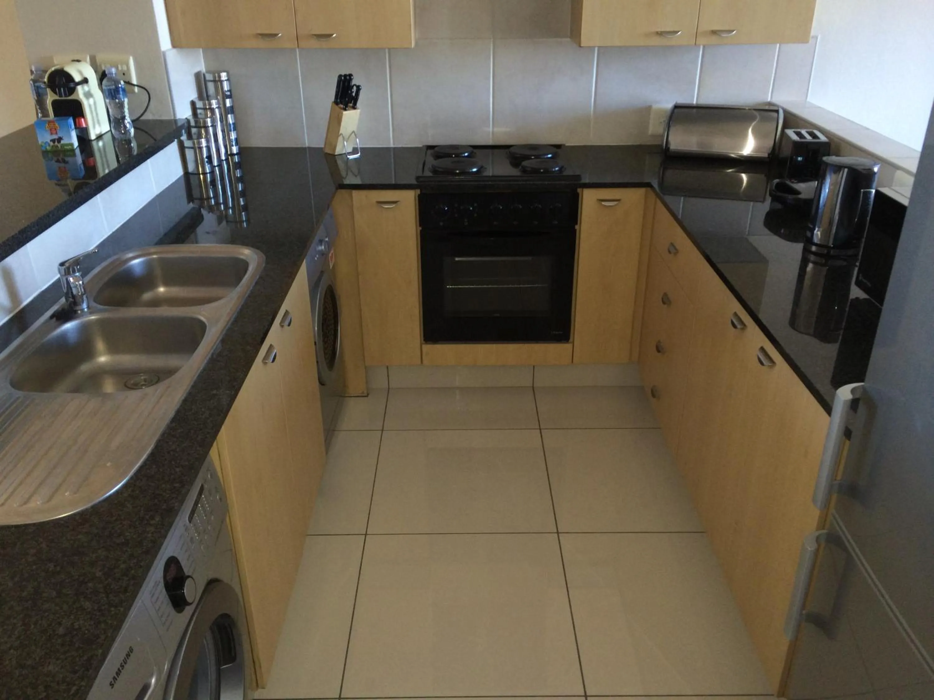 Kitchen or kitchenette in Prestige Apartments Sandton at Westpoint