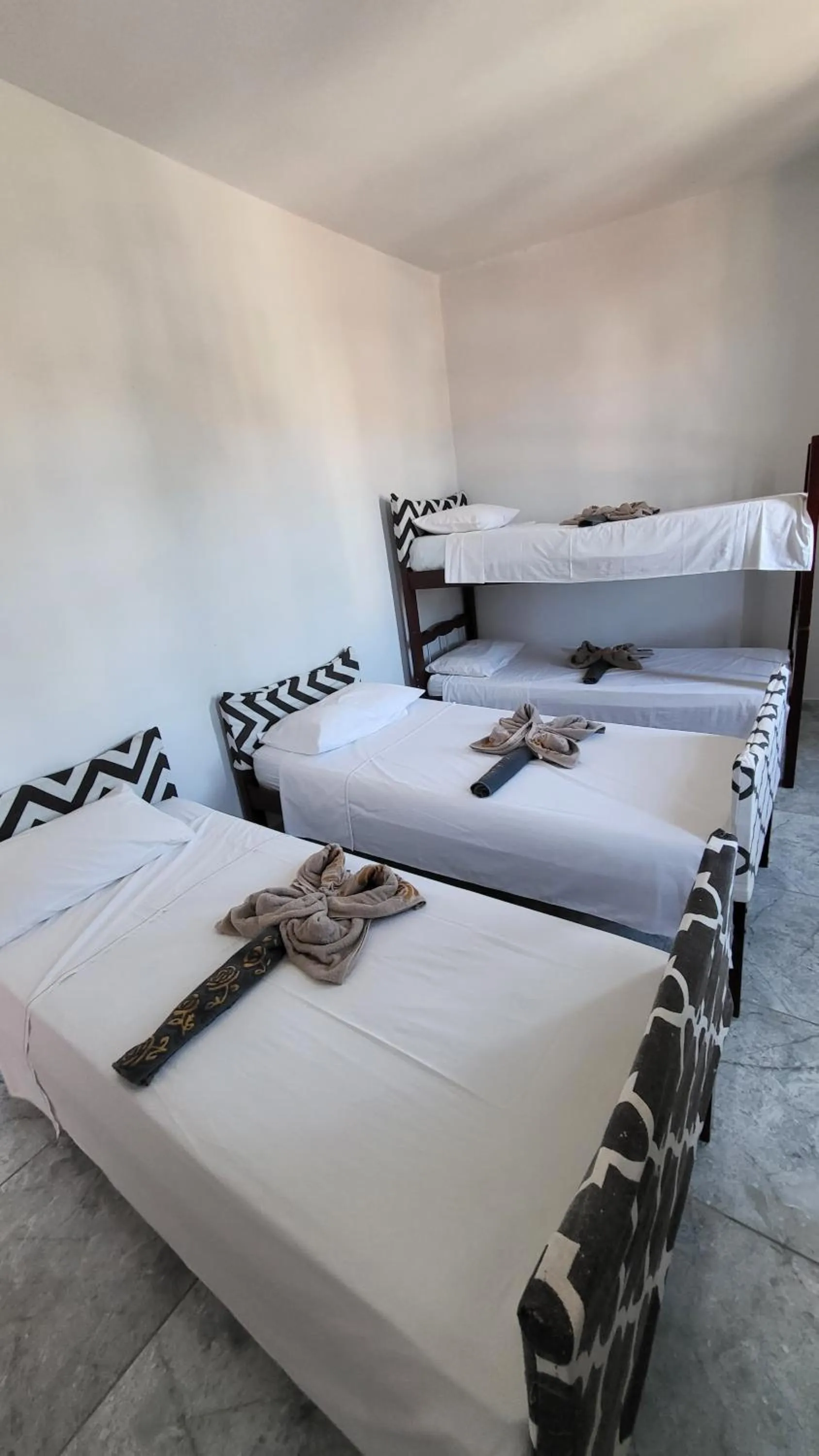 Bed in Tamboleiro's Hotel Residence