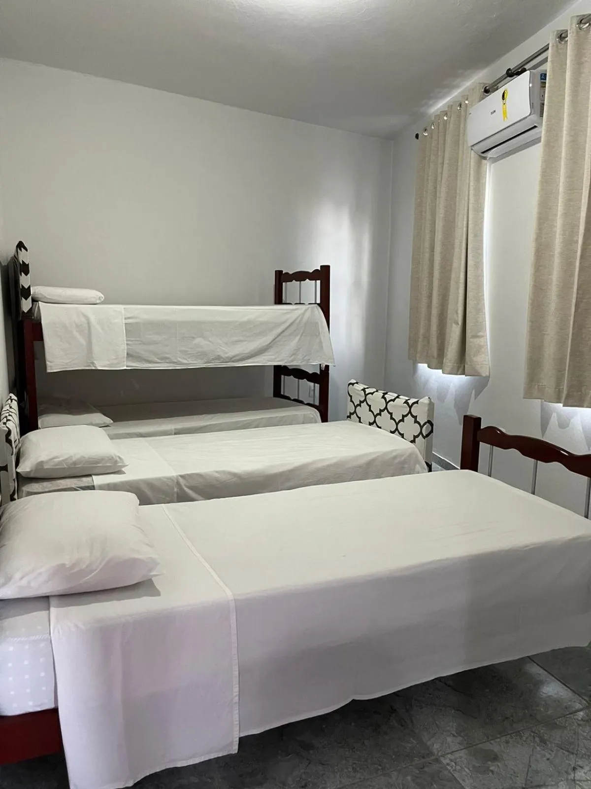 Bed in Tamboleiro's Hotel Residence