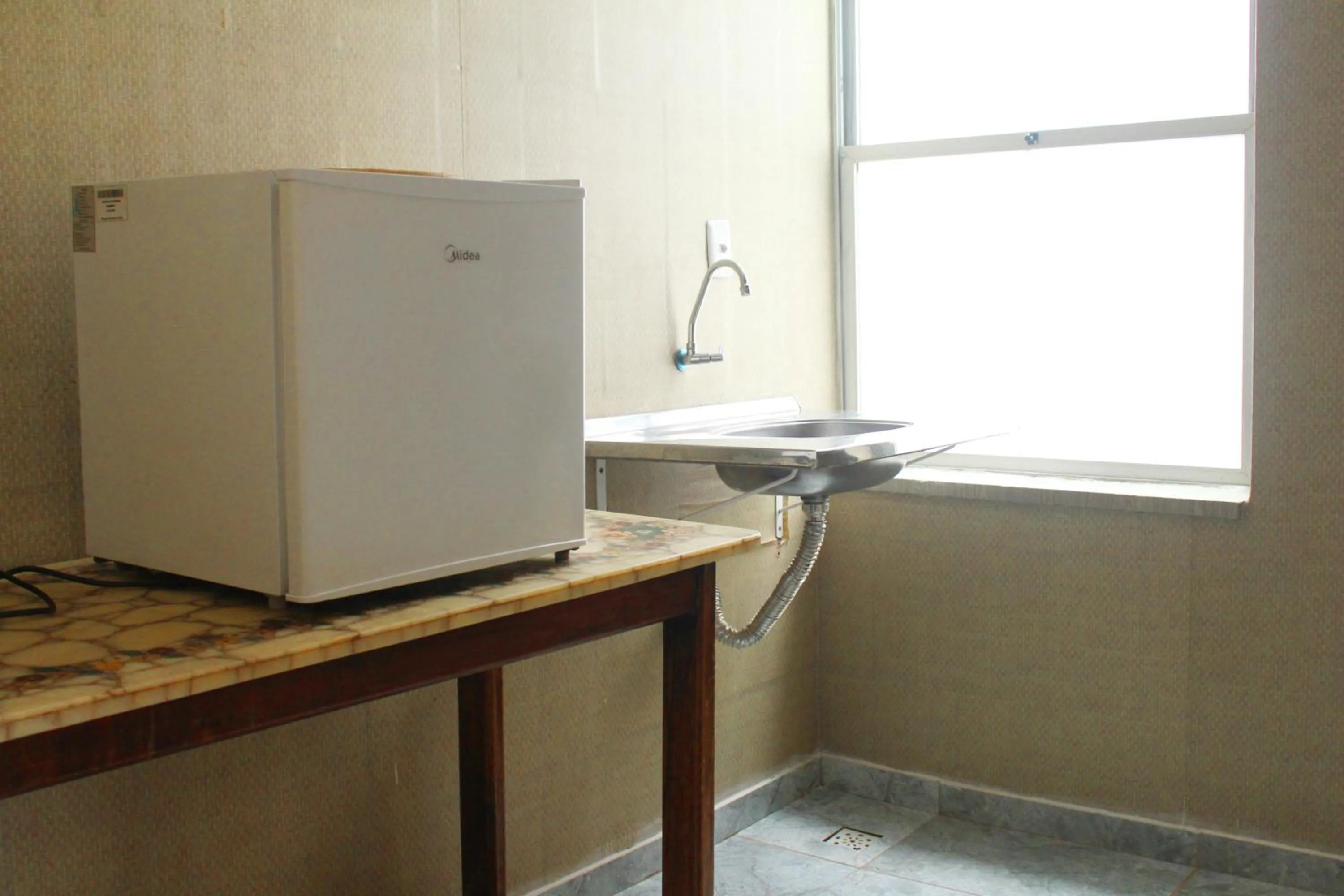 Kitchen or kitchenette in Tamboleiro's Hotel Residence