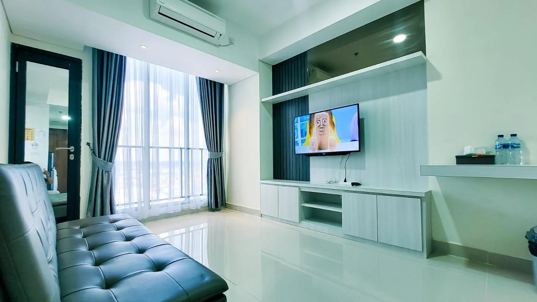 TV and multimedia in Palam Mansion at Meisterstadt Pollux Habibie Apartment