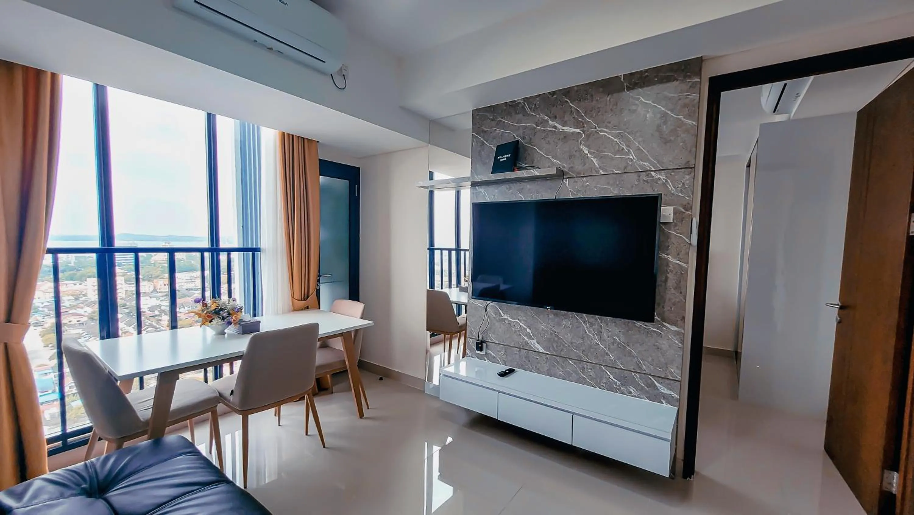 TV and multimedia in Palam Mansion at Meisterstadt Pollux Habibie Apartment