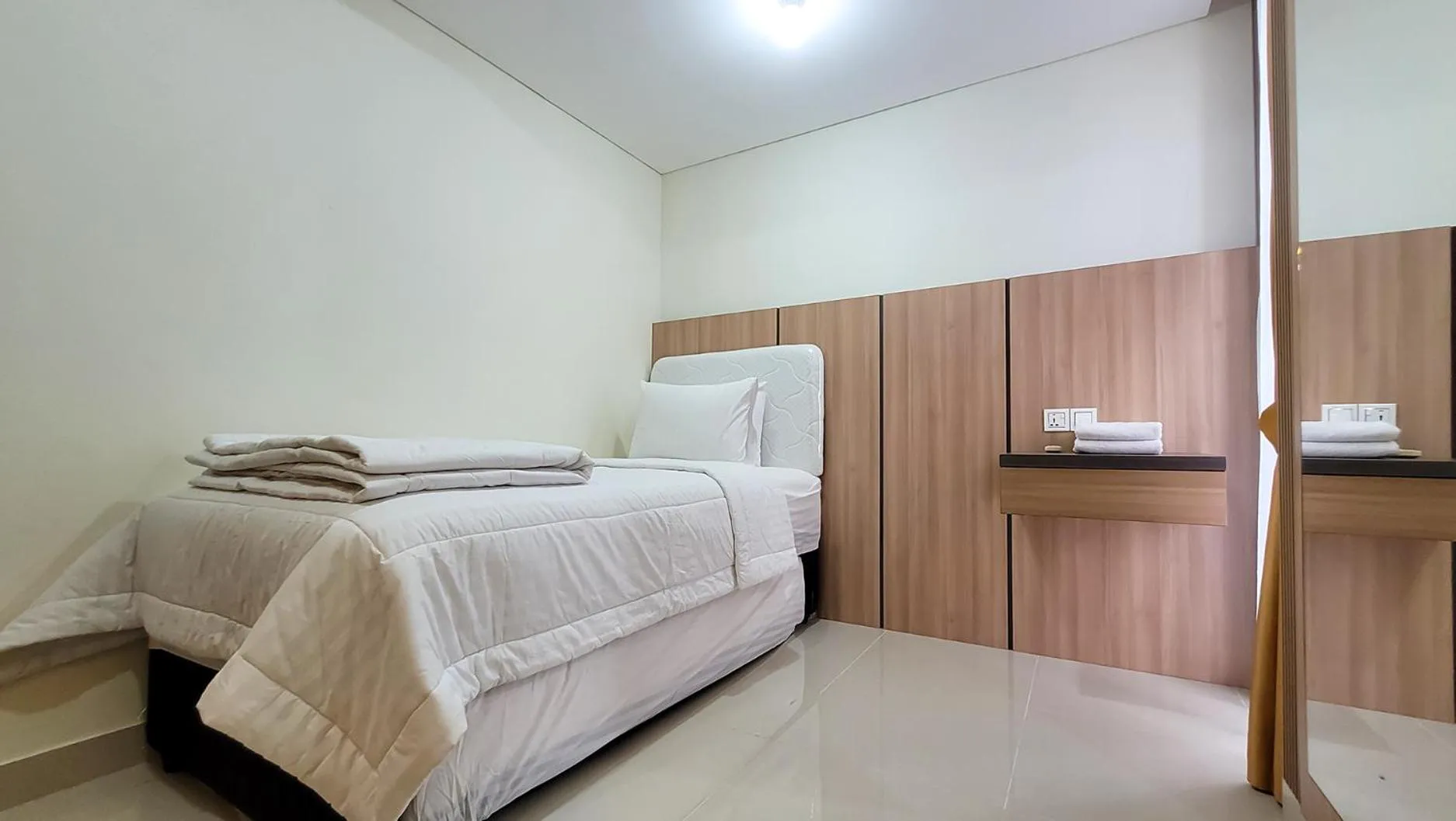 Bed in Palam Mansion at Meisterstadt Pollux Habibie Apartment